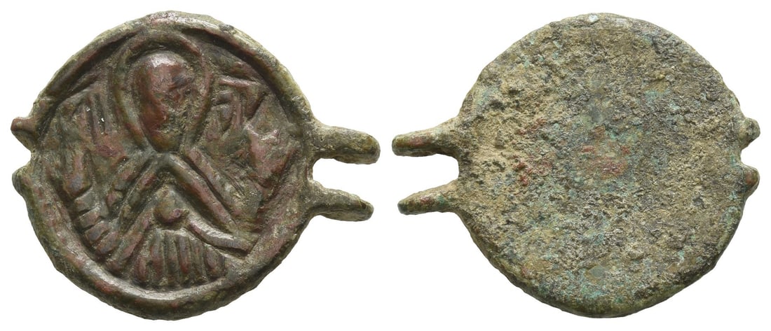 Byzantine AE Amulet.: 2nd millennium AD. Stylised nimbate bust of the Virgin orans with Christ on her breast / Blank. 5.27gr, 26mm, 12h. From the collection of a gentleman, acquired on the London art market in the 1990s. T