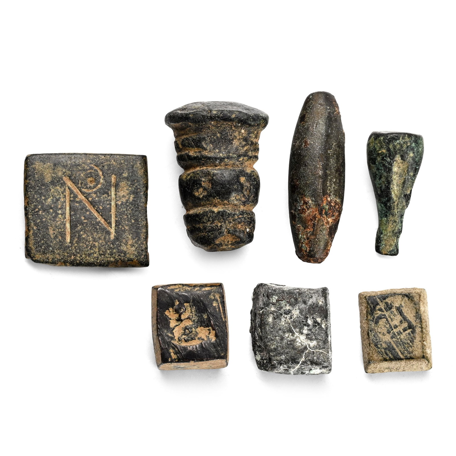 Group of Seven [7] AE Weights.: Circa 15th century BC-7th century AD. Various standards. 38.5gr total. (3/8 - 7/8 in.). From the collection of a gentleman, acquired on the London art market in the 1990s. TimeLine Auctions follows a 