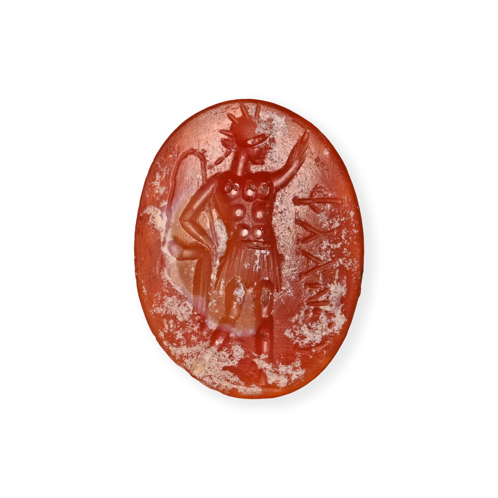 Roman Carnelian Gemstone with Sol and Greek Inscription: 1st century A.D. Domed base, featuring a standing god Sol (Greek Helios) wearing a radiate crown and muscled cuirass, his left arm raised and the right hand holding a long whip, Greek inscription '???
