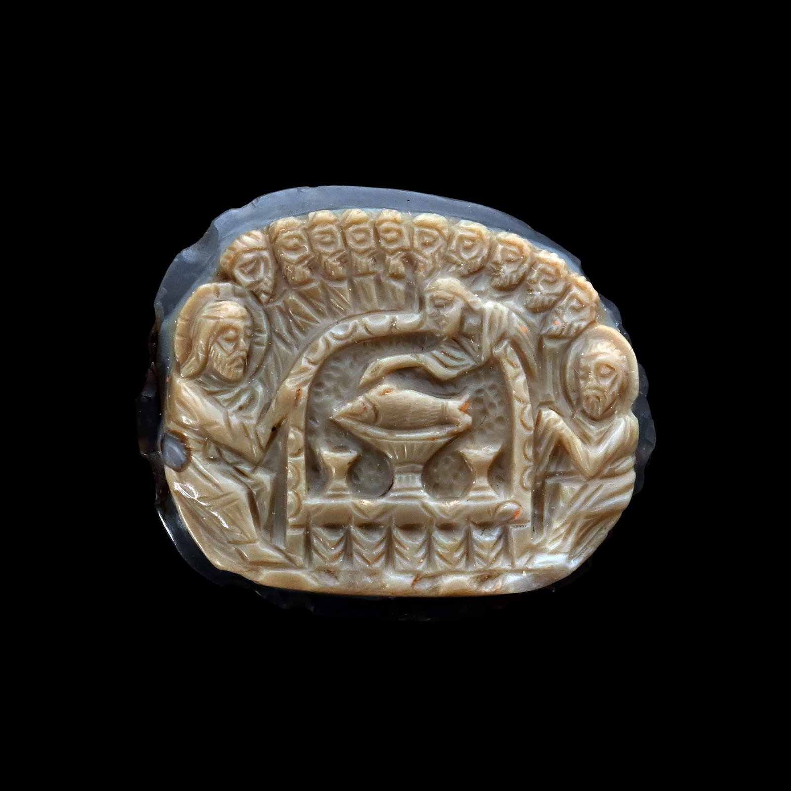 Byzantine Carved Agate Cameo of The Holy Banquet: 6th-8th century A.D. Plano-convex in section with low-relief carving: scene with a meal at a so-called sigma table surrounded by Christ, Peter, John and the other disciples; Christ and Peter attending