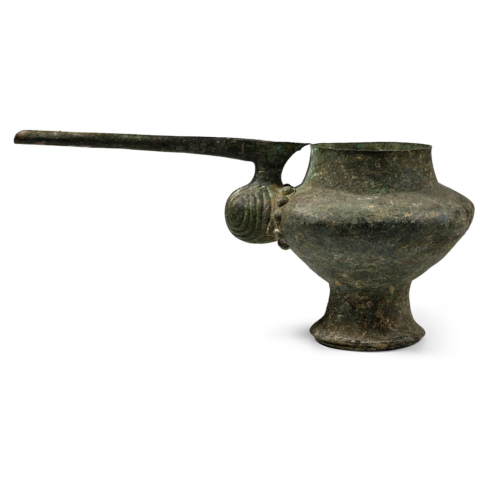 Large Amlash Bronze Spouted Libation Vessel: Circa 1200-1000 B.C. One of the largest known examples, comprising a thin-walled body and flaring foot, a separately made long spout rivetted to the body; the U-shaped spout resembling the beak of a b