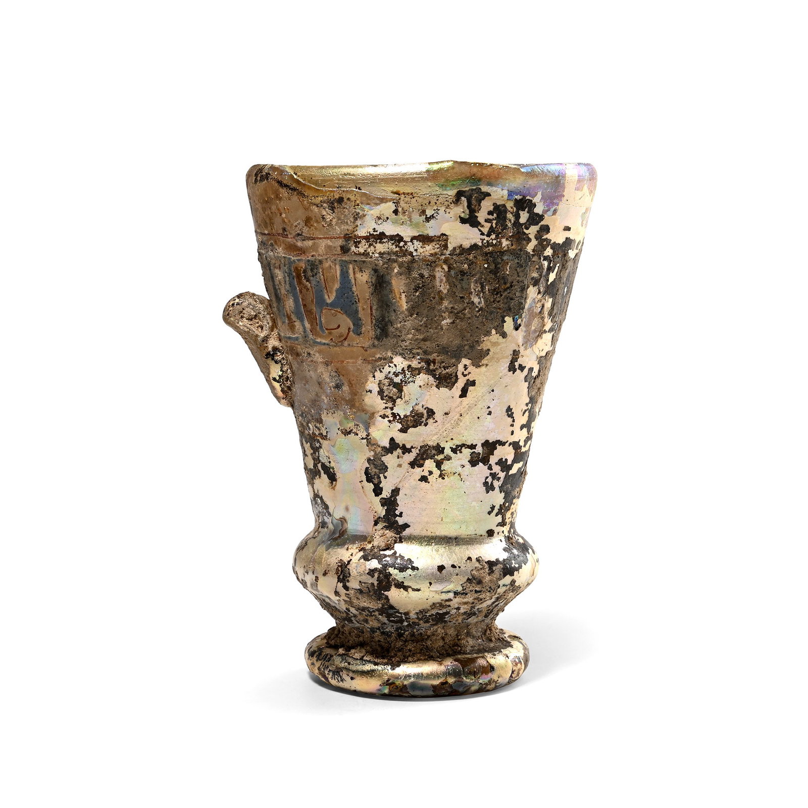 Islamic Glass Calligraphic Vessel with Inscriptions: 13th-14th century A.D. Conical in profile with carinated collar above the waisted foot; iridescent surface; applied band of calligraphic Kufic text within borders; single applied narrow loop handle. C