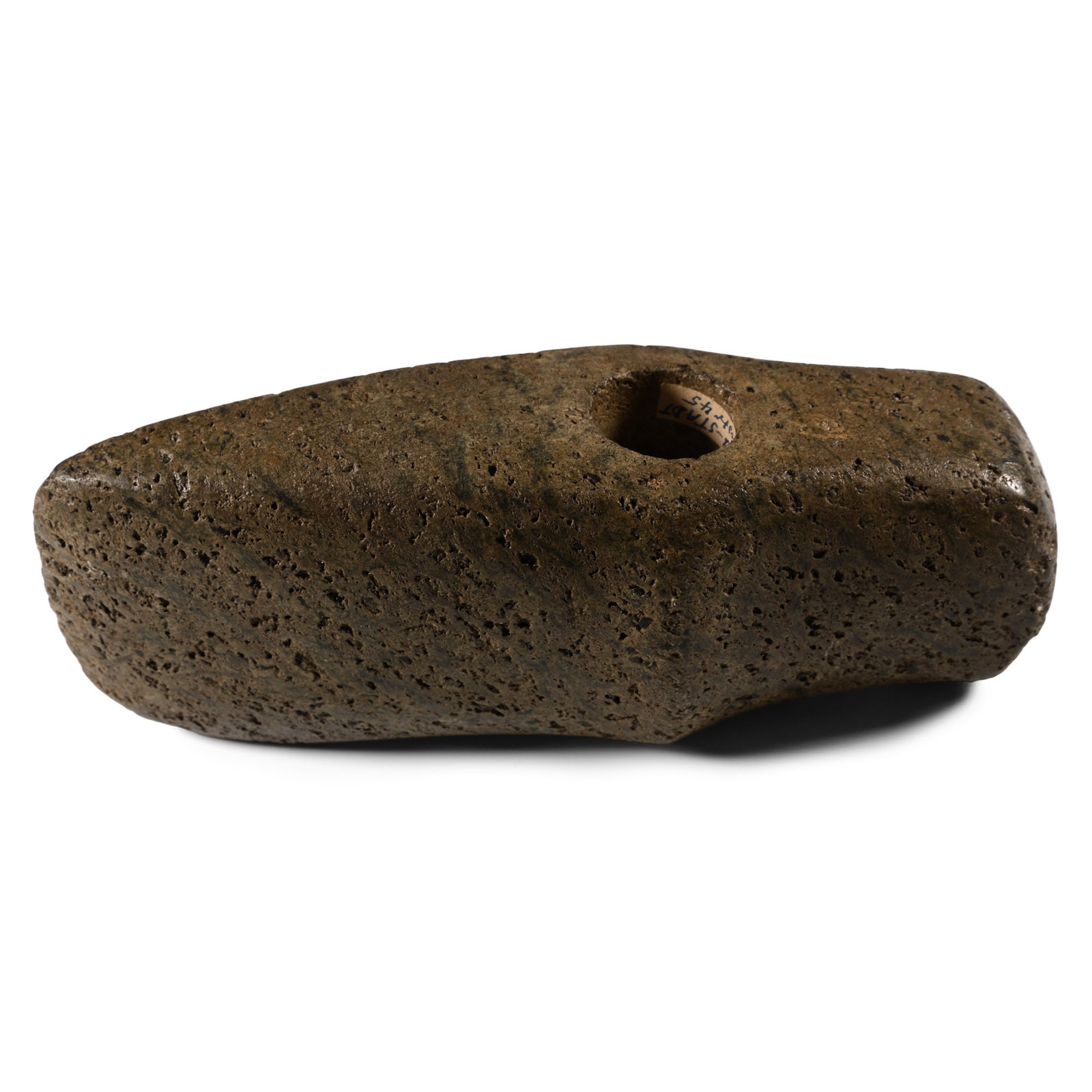 Stone Age Pierced Boat-Shaped Axehead: Neolithic Period, 4th millennium B.P. Boat-shaped in plan with central drilling; domed hammer-face to butt, carination to each broad face. Cf. MacGregor, A. (ed.), Antiquities from Europe and the Near