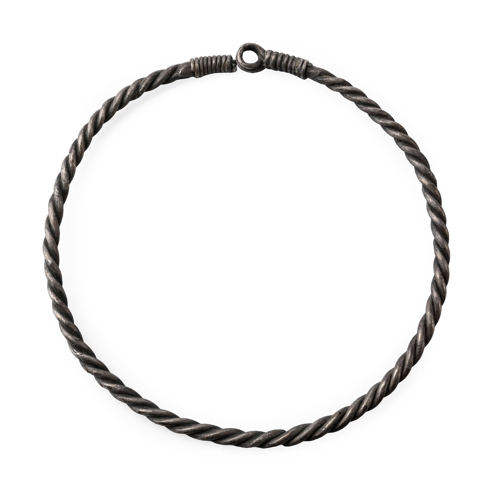 Viking Age Silver Twisted Torc: 8th-9th century A.D. Penannular torc formed of two round-section rods with a looped terminal. 54 grams, 14 cm (5 1/2 in.). Acquired on the UK art market. Private collection, Suffolk. TimeLine Auctions