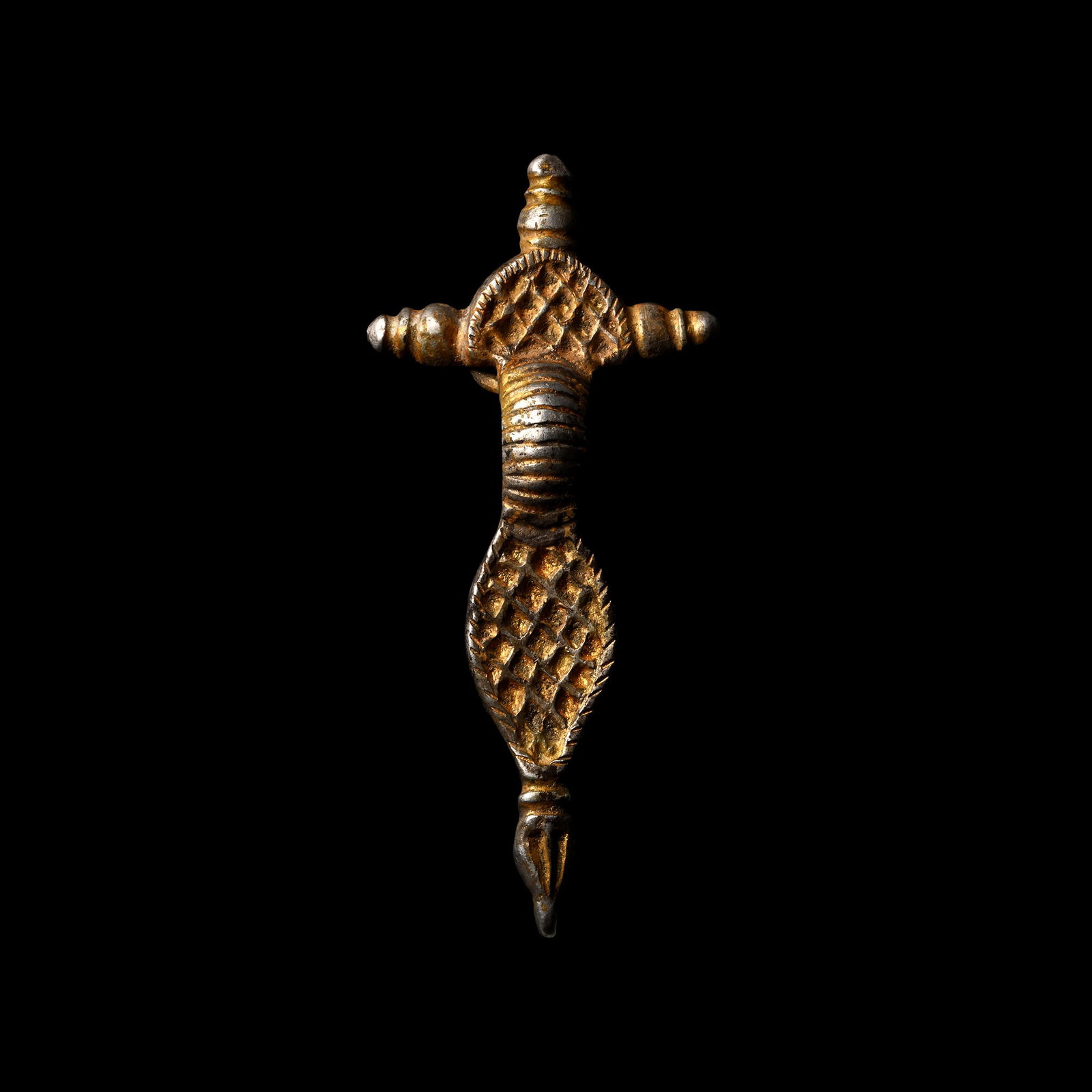 Frankish Silver-Gilt Radiate-Headed Bow Brooch: Circa 6th century A.D. Comprising a D-shaped headplate with notched border and reserved lattice ornament; three collared knops to the outer edge; shallow segmented bow; lozengiform footplate with notc