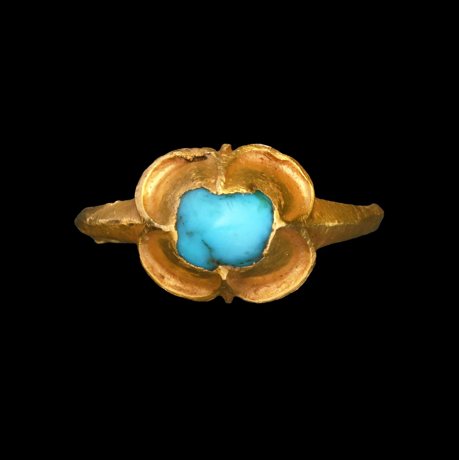 Medieval Gold Ring with Turquoise: 1200-1500 A.D. Comprising a slender hoop with a high pie-crust bezel with a cabochon turquoise within a rub-over setting. See Portable Antiquities Scheme (PAS) report no.YORYM-1E3B30. 3.46 grams, 22.7