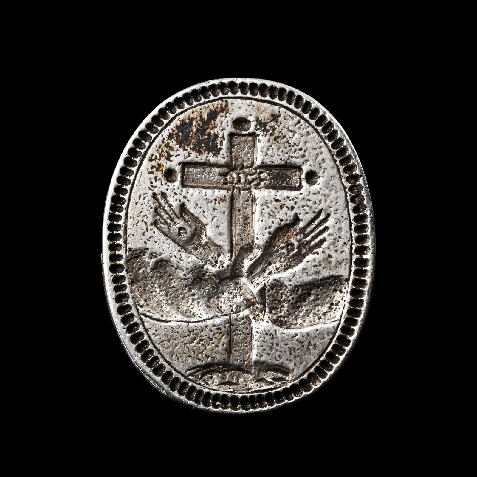 Post Medieval Silver Religious Seal with Boxwood Handle: 17th-18th century A.D. Comprising a balustered wooden handle and a silver stamp seal with a large cross behind two crossed hands with stigmata, the cross with an inscription, supplied with a museum-qu