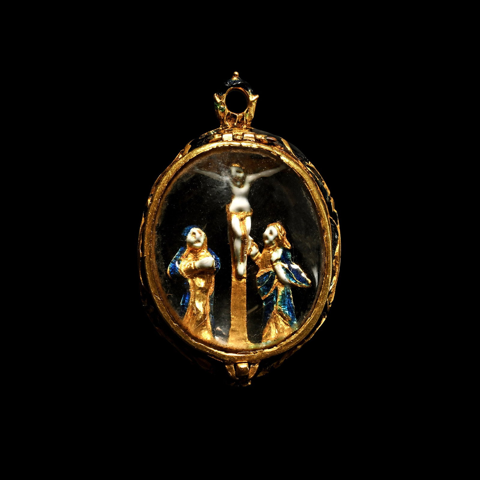 Spanish Rock Crystal and Enamelled Gold Crucifixion Pendant: Early 17th century A.D. Devotional pendant with a finely chased and adorned frame with black enamel, encased within a double-sided polychrome enamelled gold Calvary scene, depicting Christ upon the cr