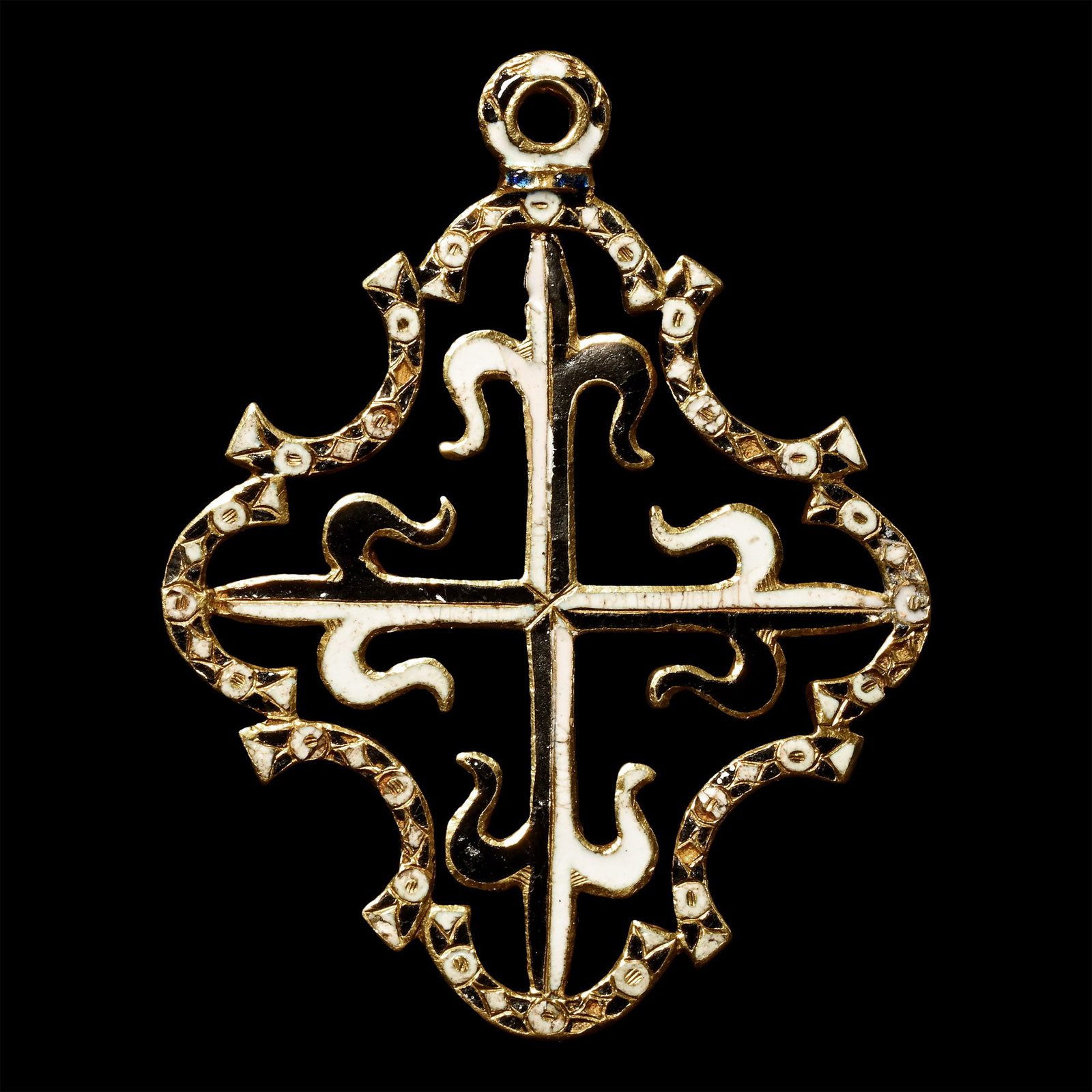 Gold and Enamelled Pendant for the Order of Saint Dominic: Spain, circa 1630 A.D. Bifacial openwork pendant decorated with black and white enamel, featuring a central cross with fleur-de-lys terminals, the border decorated with alternating lozenges and annule