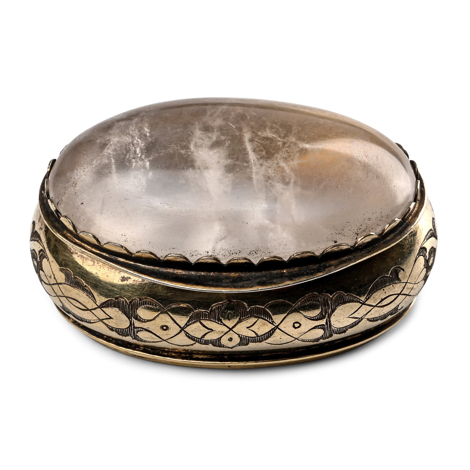 Post Medieval Engraved Silver-Gilt Rock Crystal Set Box: Germany, 18th century A.D. Lid set with a large rock crystal cabochon; gilded interior; sides engraved with a continual Renaissance interlace and similar to the base; small French duty mark to the fro