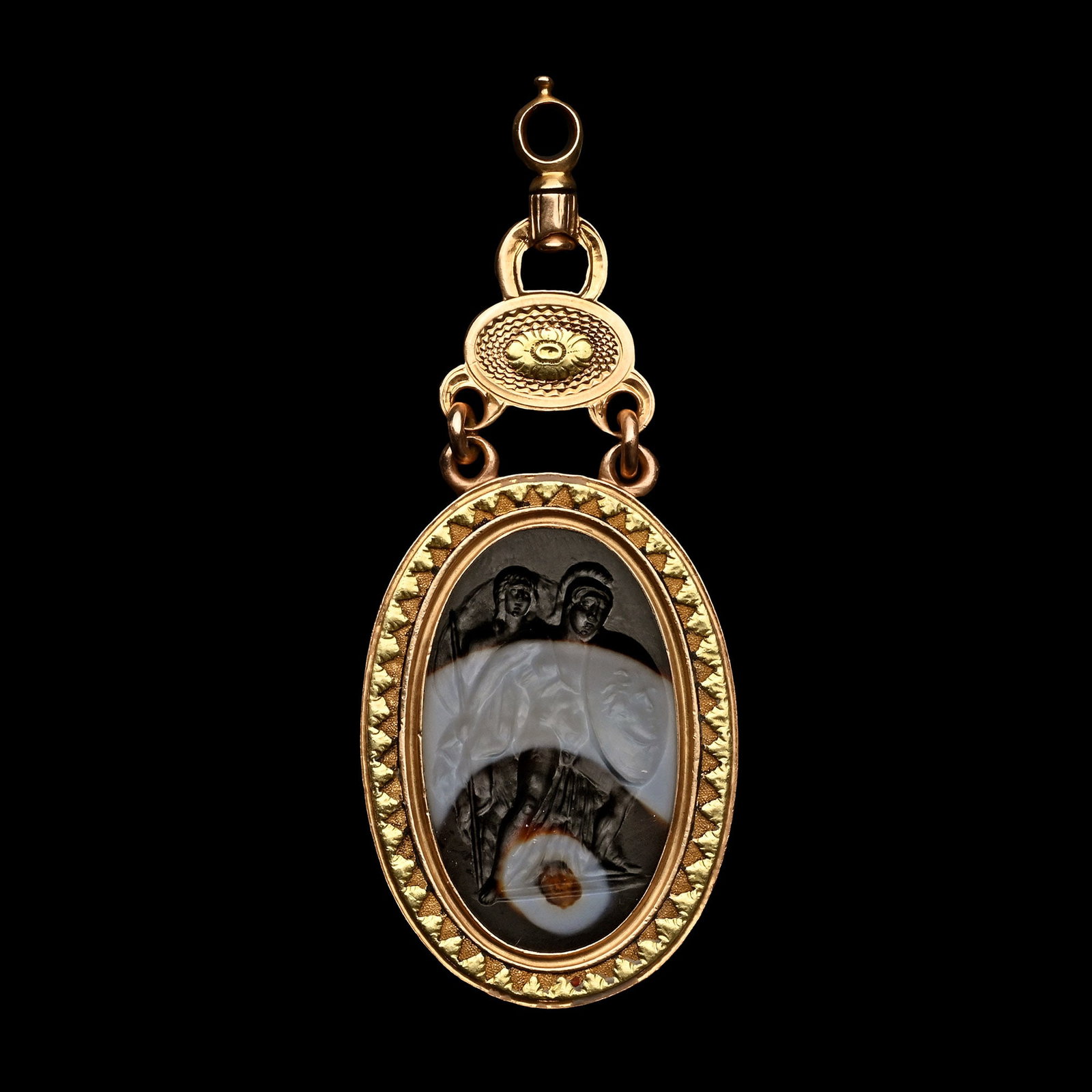 Banded Agate Intaglio Depicting Perseus and Andromeda in Gold Pendant: Italy, 17th-18th century A.D. Translucent intaglio featuring a dynamic mythological scene of Perseus rescuing Princess Andromeda; Perseus depicted nude and wearing a crested helmet, holding a round sh