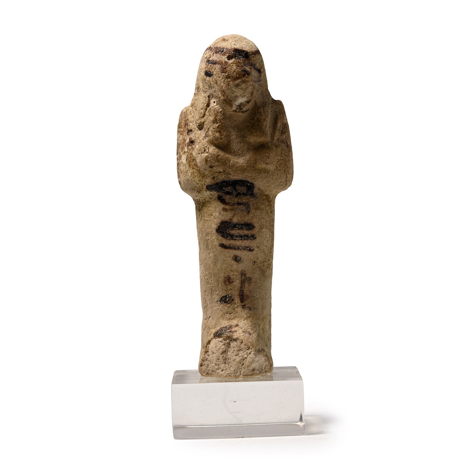 Egyptian Faience Shabti of Tent-Aset: Third Intermediate Period, 22nd Dynasty, circa 945-715 B.C. Mummiform figure depicted with a tripartite wig and holding two hoes in crossed hands, with a painted seed-bag on the reverse and a headband