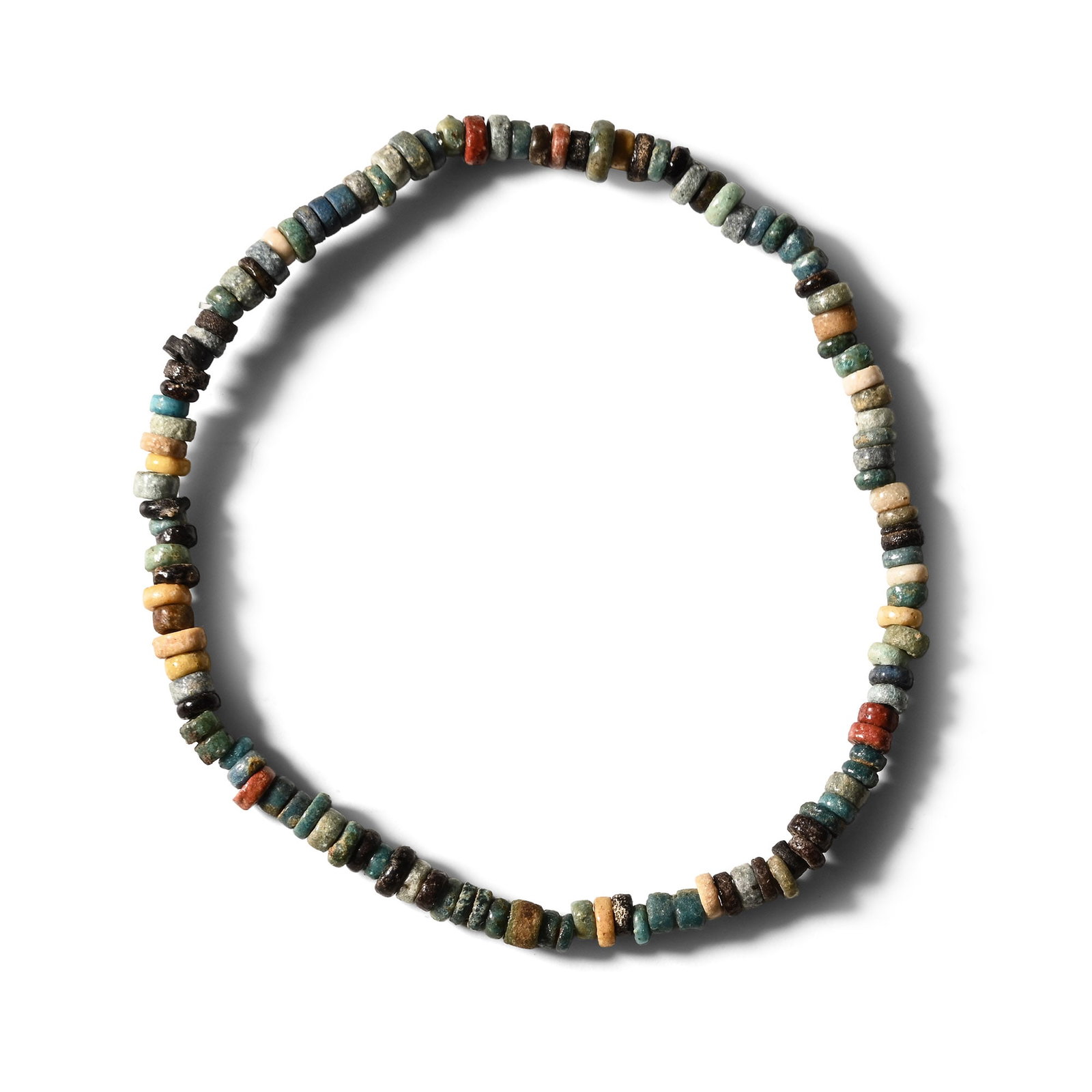 Egyptian Faience Mummy Bead Bracelet: Late Period, 664-332 B.C. Composed of blue, cream, black, green and red annular beads, restrung with an elasticated string. 2.23 grams, 18 cm (7 in.). [No Reserve] Ex Ancient Art Shop, Windsor, UK, 19