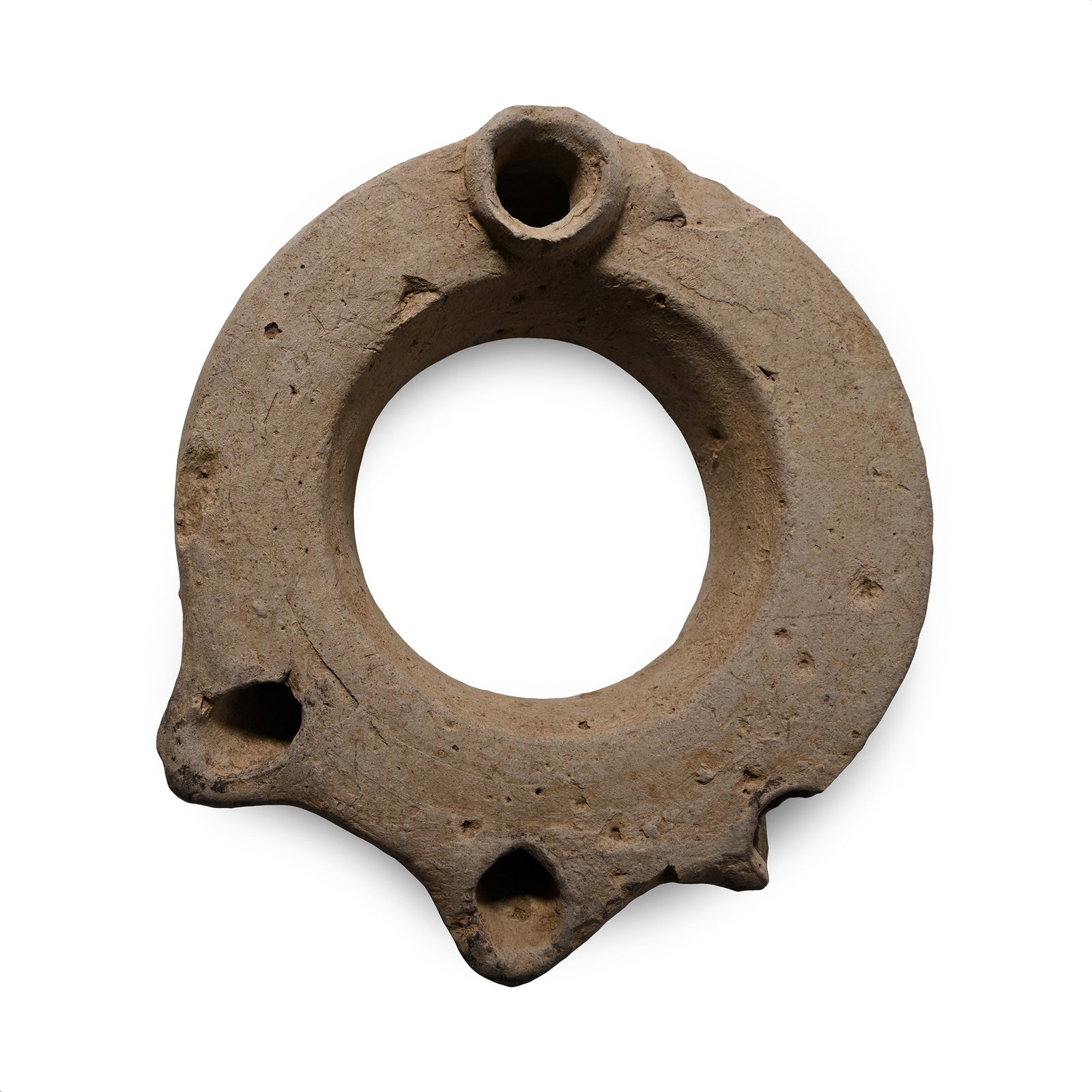 Greek Terracotta Multi-Spouted Oil Lamp: Circa 2nd-1st century B.C. An annular oil lamp with three nozzles and a filler hole to the rear, an inked collector's note '423' on the underside. Cf. Hayes, J.W., Ancient Lamps in the Royal Ontario M