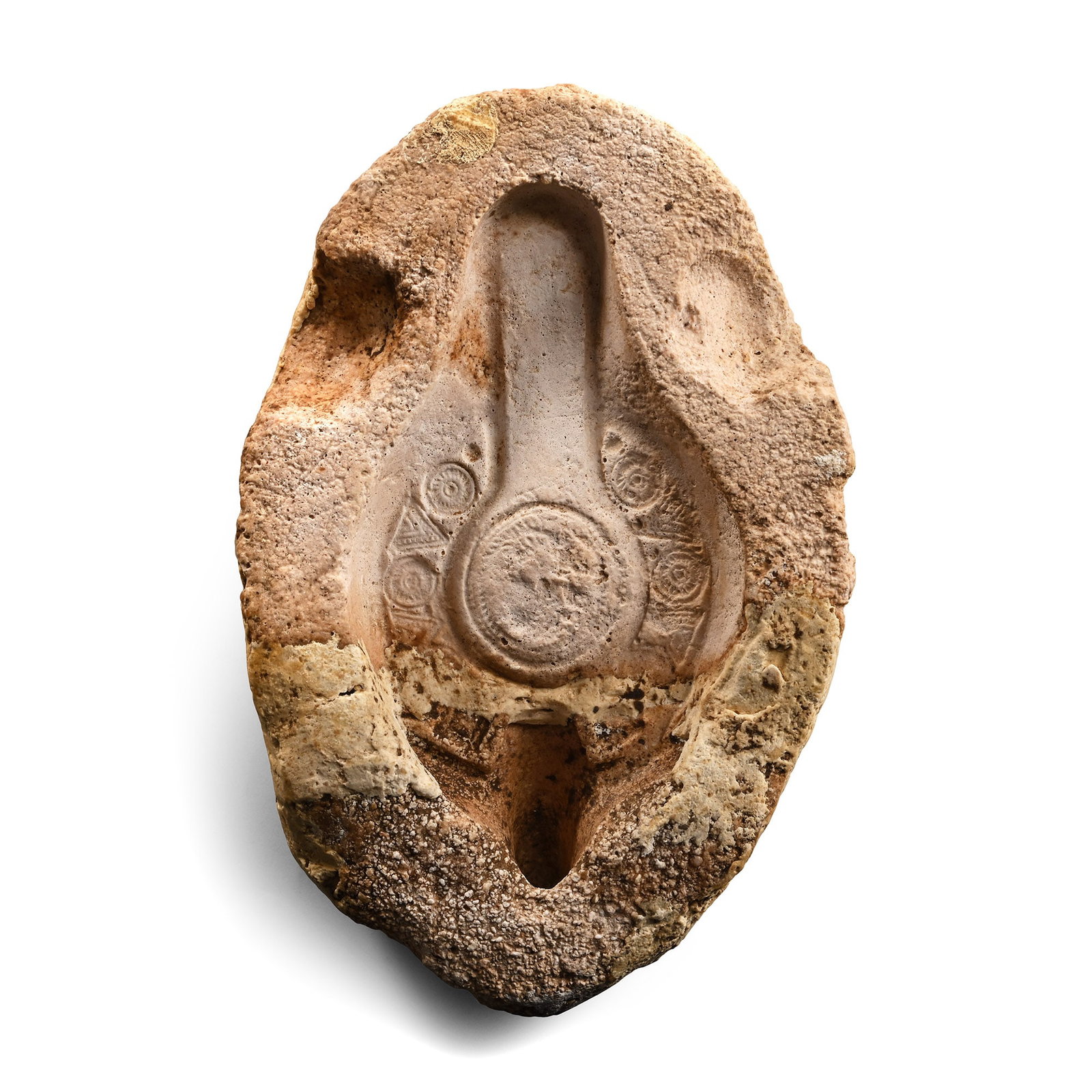 Late Roman Stone Redware Oil Lamp Upper Mould: Circa 4th century A.D. Carved mould-half for producing slipper-shaped oil lamps, with triangles and rosettes forming a band to the edge of the shoulder. 715 grams, 17.5 cm (6 7/8 in.). [No Reserve] Fr