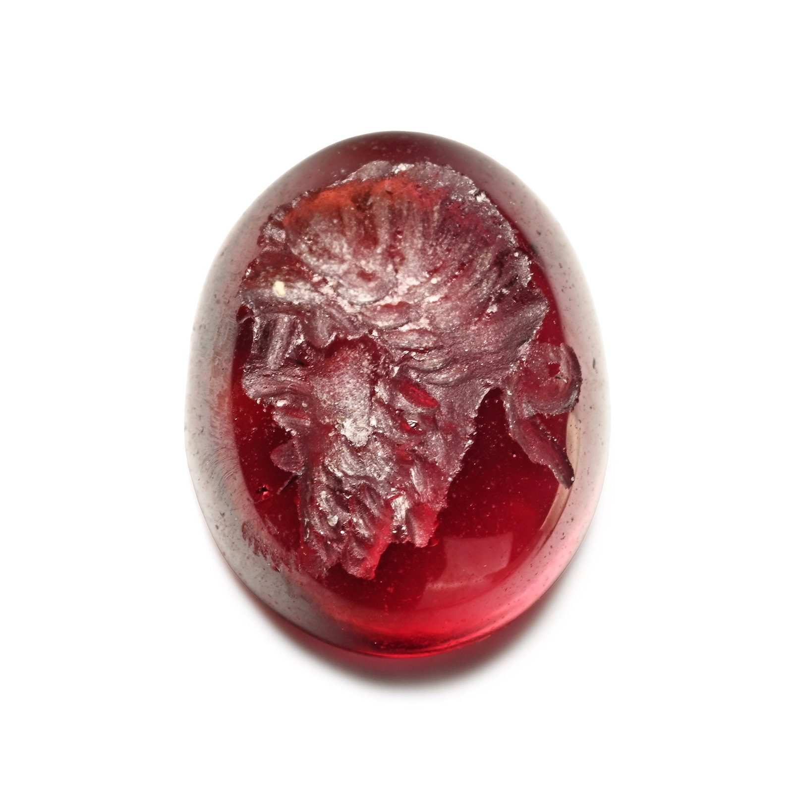 Roman Garnet Gemstone with Youthful Portrait: 2nd-3rd century A.D. Plano-convex type with incuse design of a profile portrait bust of a youthful male; supplied with a museum-quality impression. 0.43 grams, 8 mm (1/4 in.). [No Reserve] From the pr