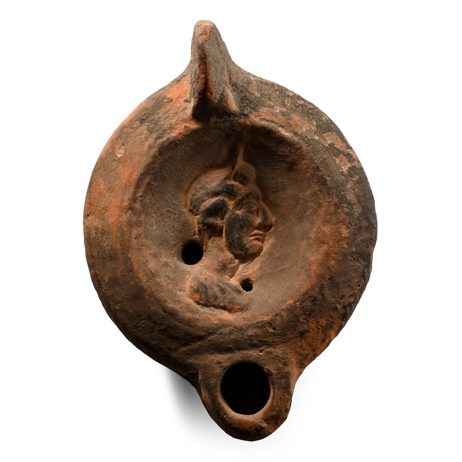Large Roman Terracotta Oil Lamp with Bust: Circa 2nd century A.D. or later. Rounded body with a short nozzle and lug handle, the discus with a profile bust of a youth, inked collector's number 'L115' on the base. See Bussi?re, J. & Lindros Woh