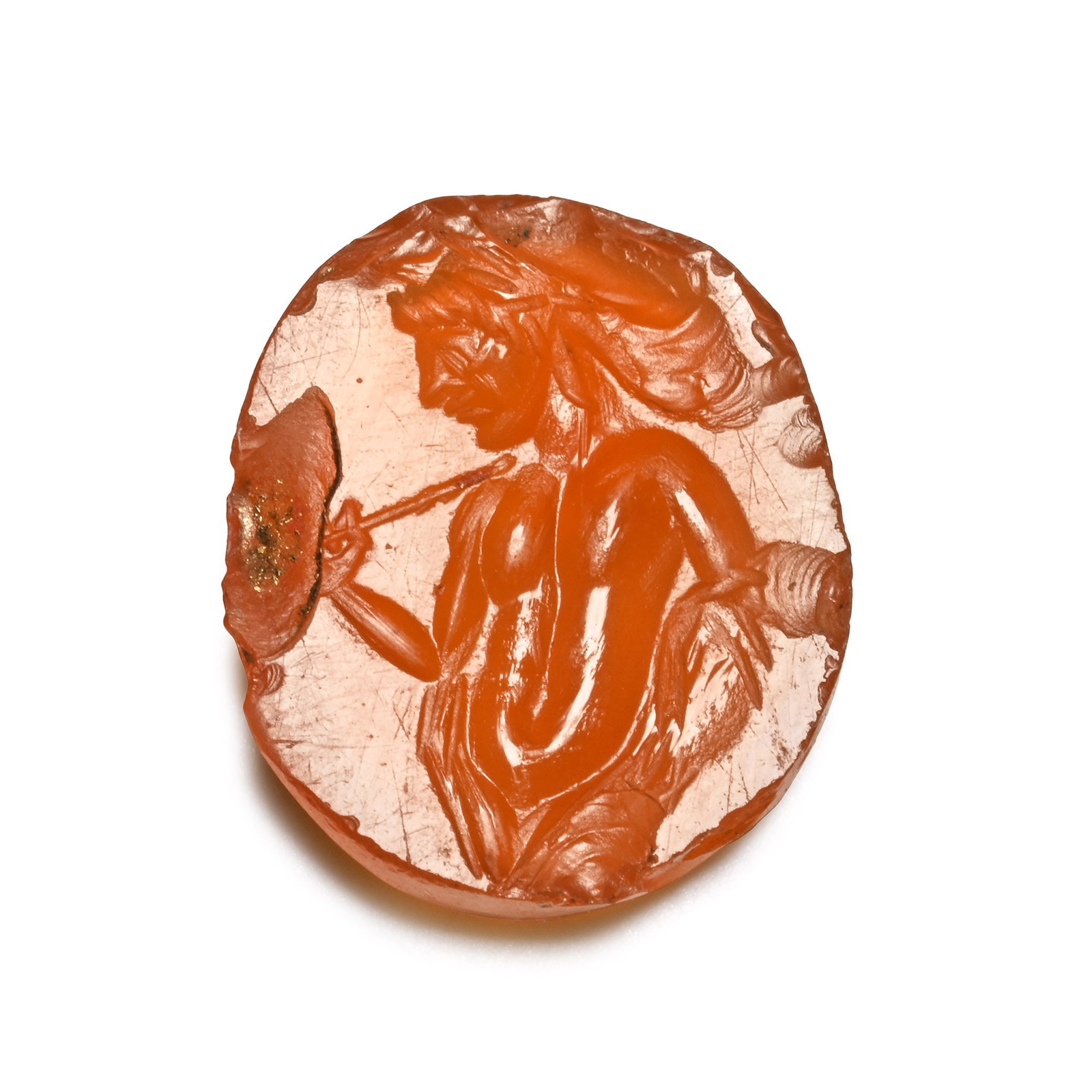 Roman Carnelian Gemstone with Dionysos: 2nd-3rd century A.D. Ellipsoid type with incuse design of Dionysos standing bare-chested with flowing hair; supplied with a museum-quality impression. 0.59 grams, 12 mm (1/2 in.). [No Reserve] From th