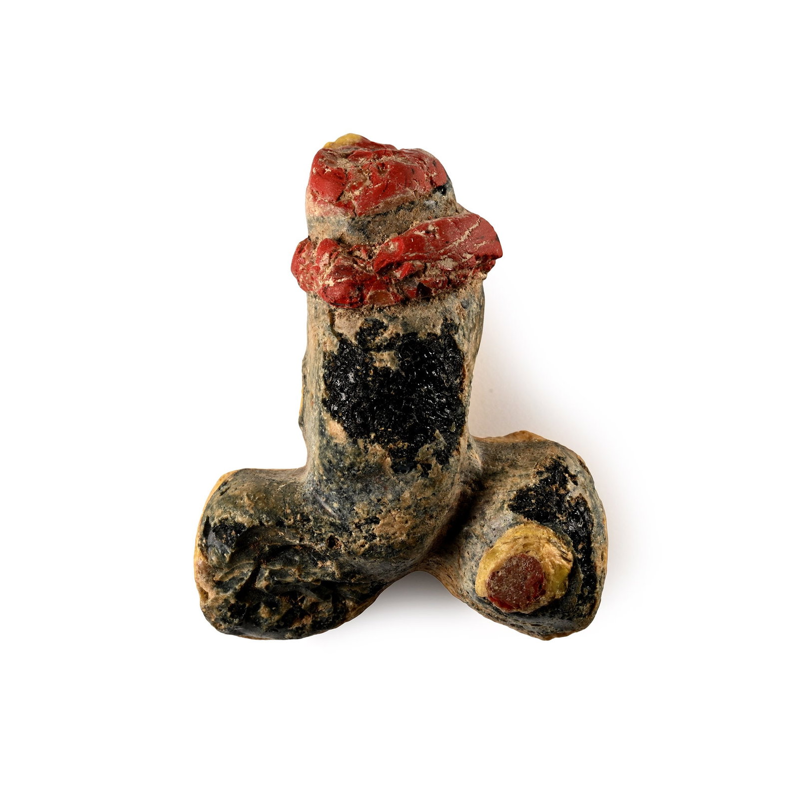 Roman Glass Phallic Amulet: 1st century B.C.-1st century A.D. Modelled in the round with applied red-glass collar, pierced through the shaft for suspension. See Rolland, H., Bronzes Antiques de Haute Provence, Paris, 1965, item 