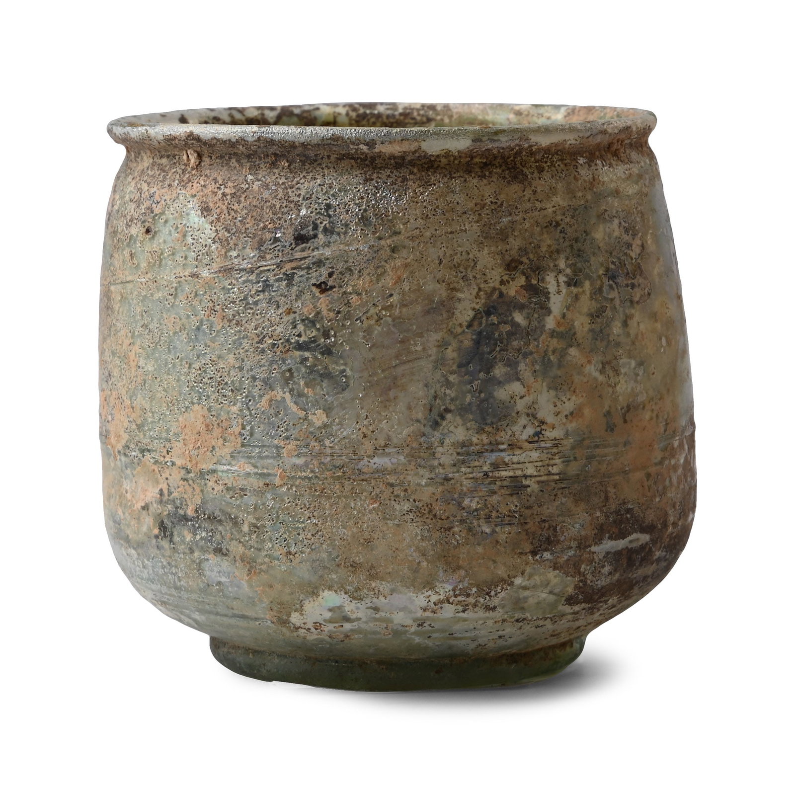Roman Iridescent Glass Cup with Trail: Circa 1st-4th century A.D. Drum-shaped body on a low basal ring and everted rim, bands to the outer face; iridescent surface. 33.8 grams, 71 mm (2 3/4 in.). From a London, UK, collection of glass, 197