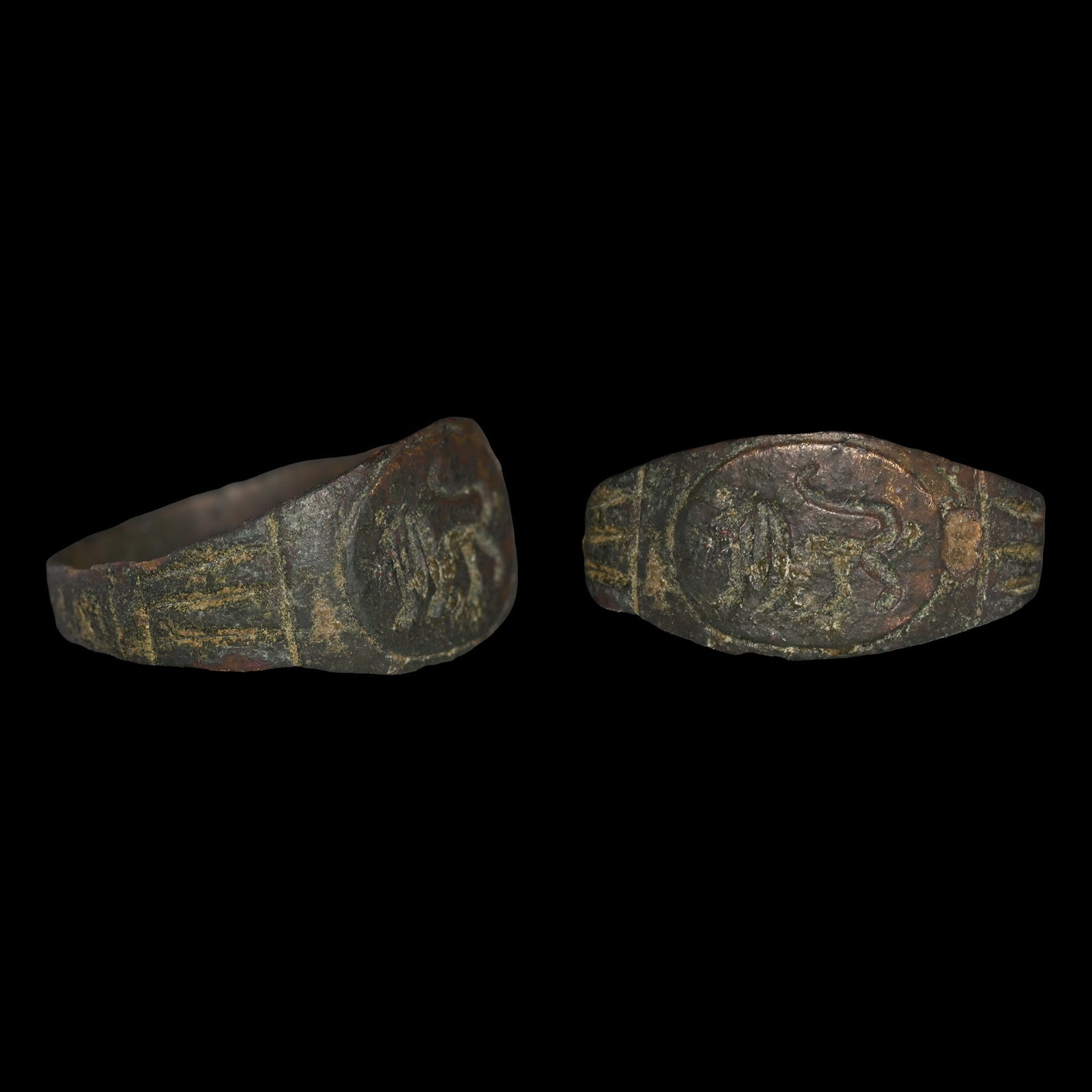 Roman Bronze Ring with Walking Lion: 3rd-4th century A.D. Featuring a slender hoop and fluted shoulders, an oval bezel with an advancing lion with its tail raised. 1.37 grams, 19.70 mm overall, 18.12 mm internal diameter (approximate siz
