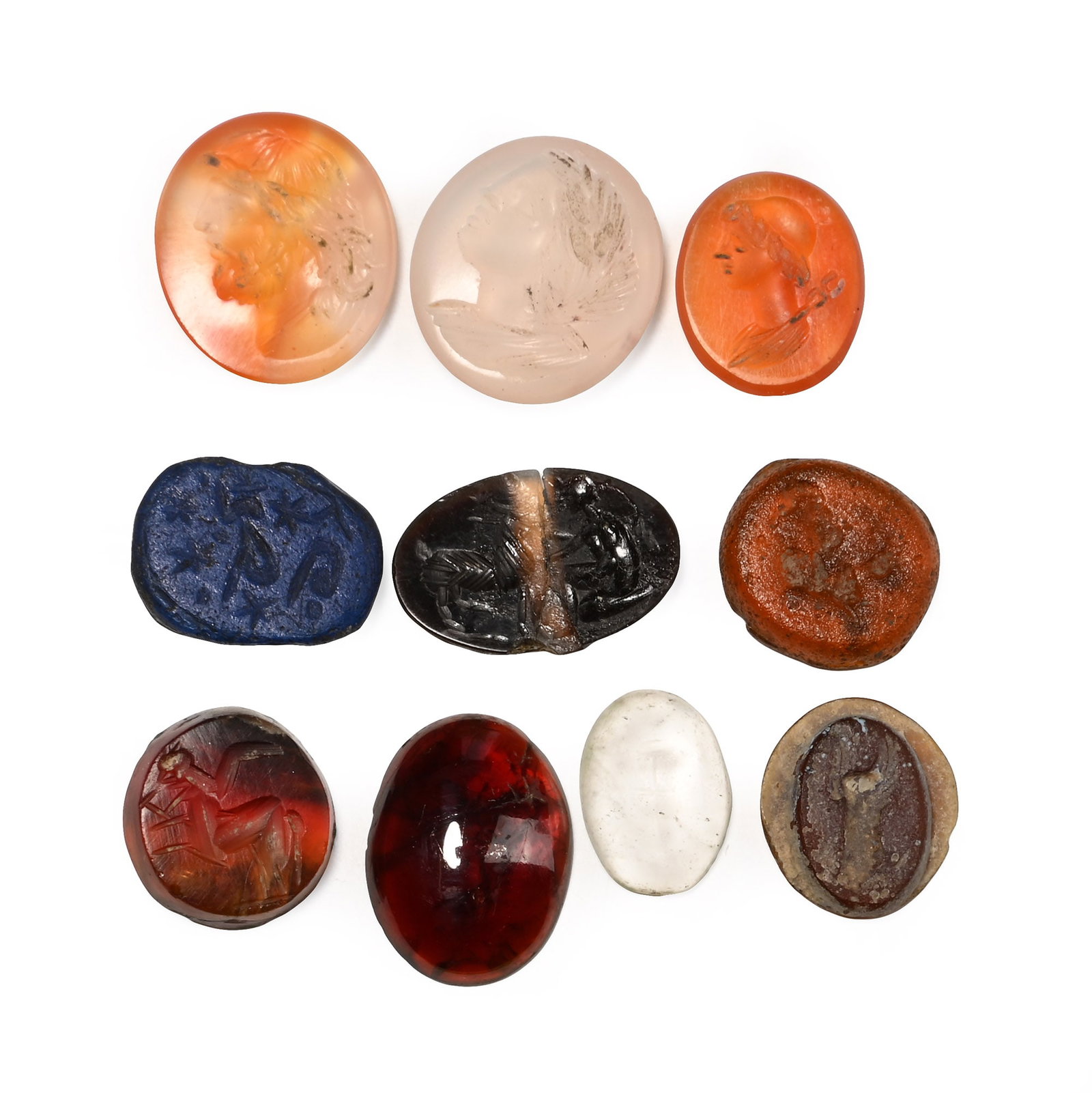 Roman and Later Gemstone Collection: Circa 2nd-3rd century A.D. and later. Comprising ten stone and glass intaglios and cabochons, including two with a female bust, one with a male bust, one with a cross, and others; one repaired. 6.24 g