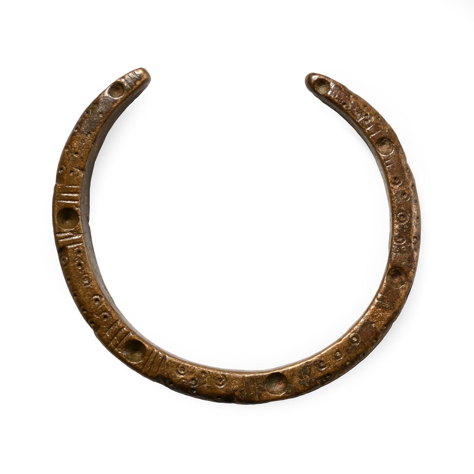 Roman Bronze Decorated Bracelet: 2nd-3rd century A.D. Penannular bracelet with rectangular-section body decorated with ring-and-dot and linear motifs. 44.6 grams, 65 mm (2 1/2 in.). [No Reserve] Ex German art market, 2000s. Acquired 