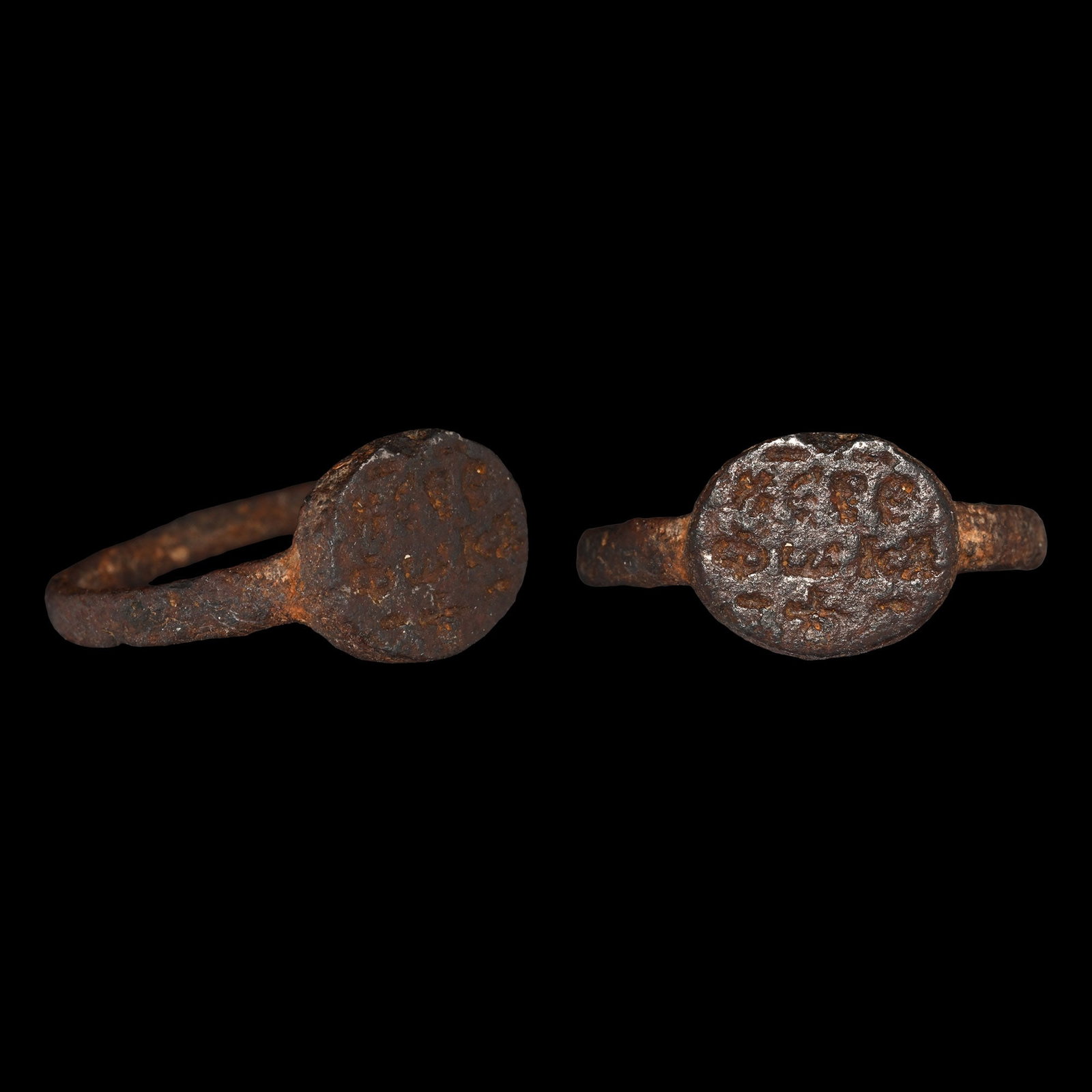 Byzantine Bronze Ring with Three Line Inscription: 6th-8th century A.D. Discoid bezel with three lines of enigmatic Greek text 'KE[.]E / ???A / -+-'; with old collector's ticket 'van Phocas'. 3.51 grams, 23.60 mm overall, 20.04 mm internal diameter (a
