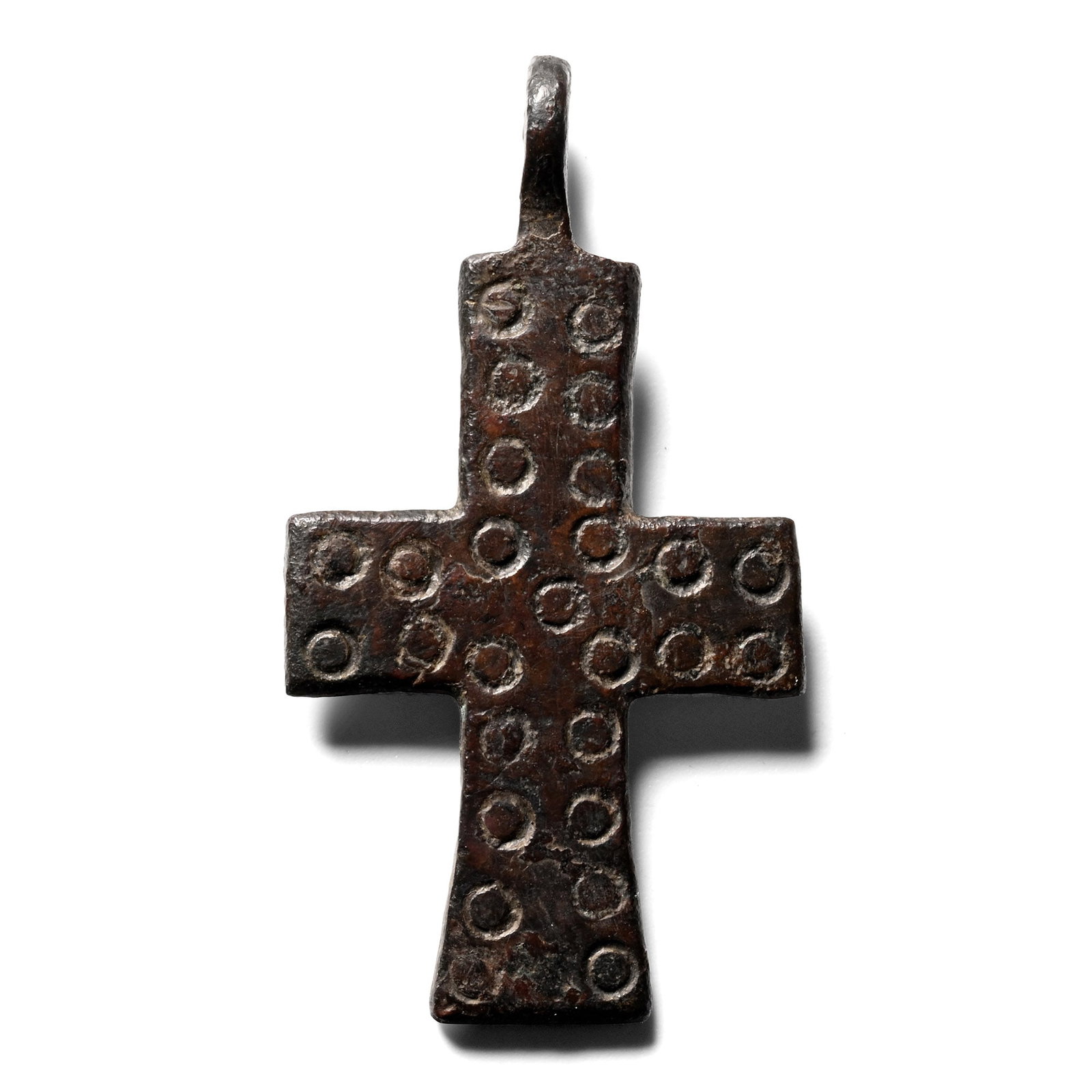 Byzantine Bronze Cross Pendant: Circa 6th-8th century A.D. Cruciform pendant with slighty expanding arms, punched annulet decoration on both sides. 5.81 grams, 40 mm (1 5/8 in.). [No Reserve] Ex German art market, 2000s. Acquired fr