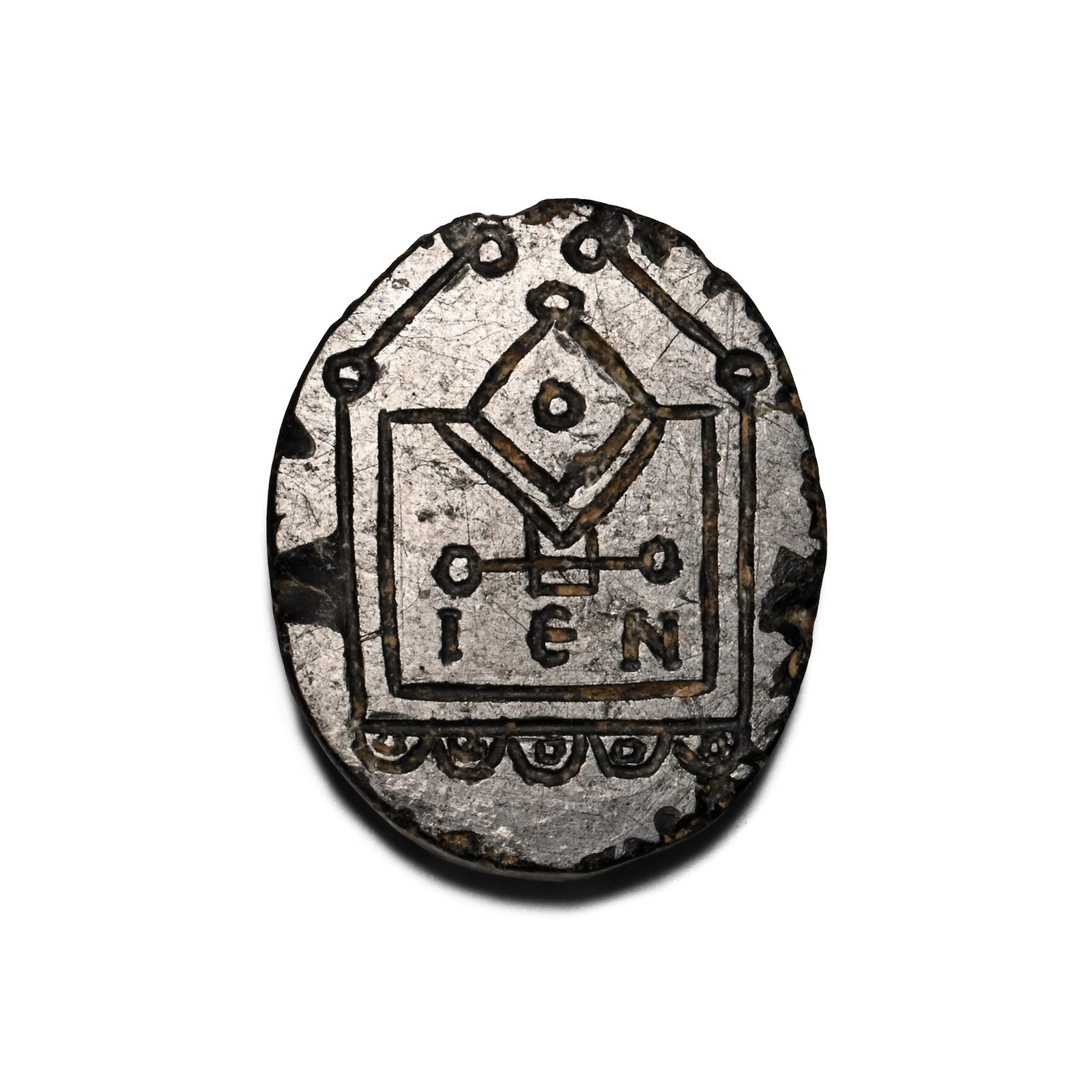 Byzantine Stone Bifacial Amulet with Church Designs: Circa 2th-14th century A.D. Bifacial plaque with geometric designs: Side A - lozenge bisecting the upper edge of a square with 'o' to the centre, 'IEN' below, horseshoe motifs to the edge; Side B - pe