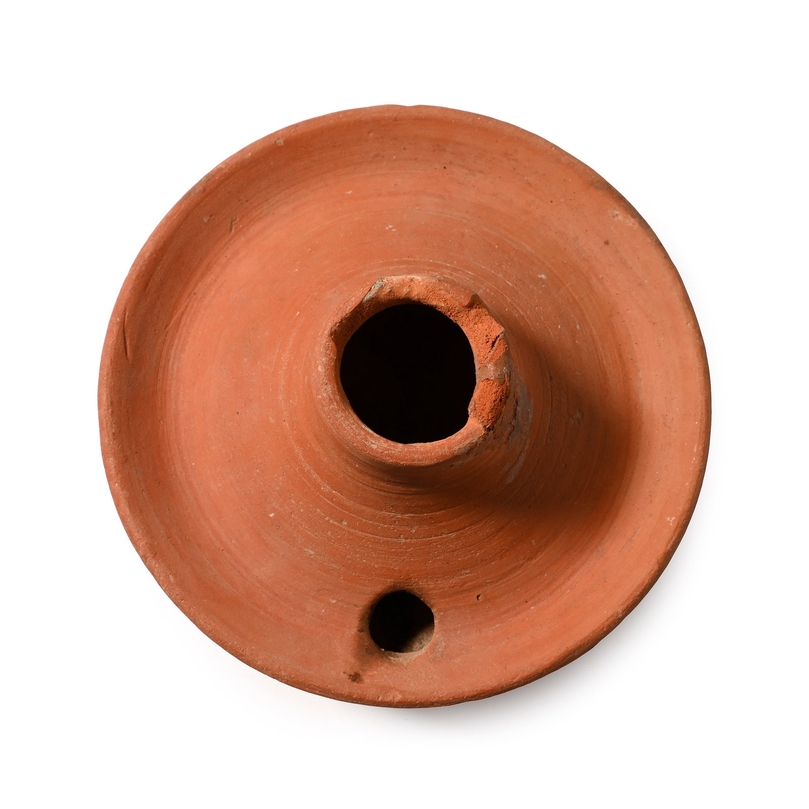 Byzantine Terracotta Discoid Oil Lamp: Circa 6th-8th century A.D. Circular lamp with raised flange on the rim, short conical neck and a low basal ring. Cf. Brooner, O., Corinth, IV, II, Terracotta Lamps, nos.1519-1530, pl.XXIV, for the typ