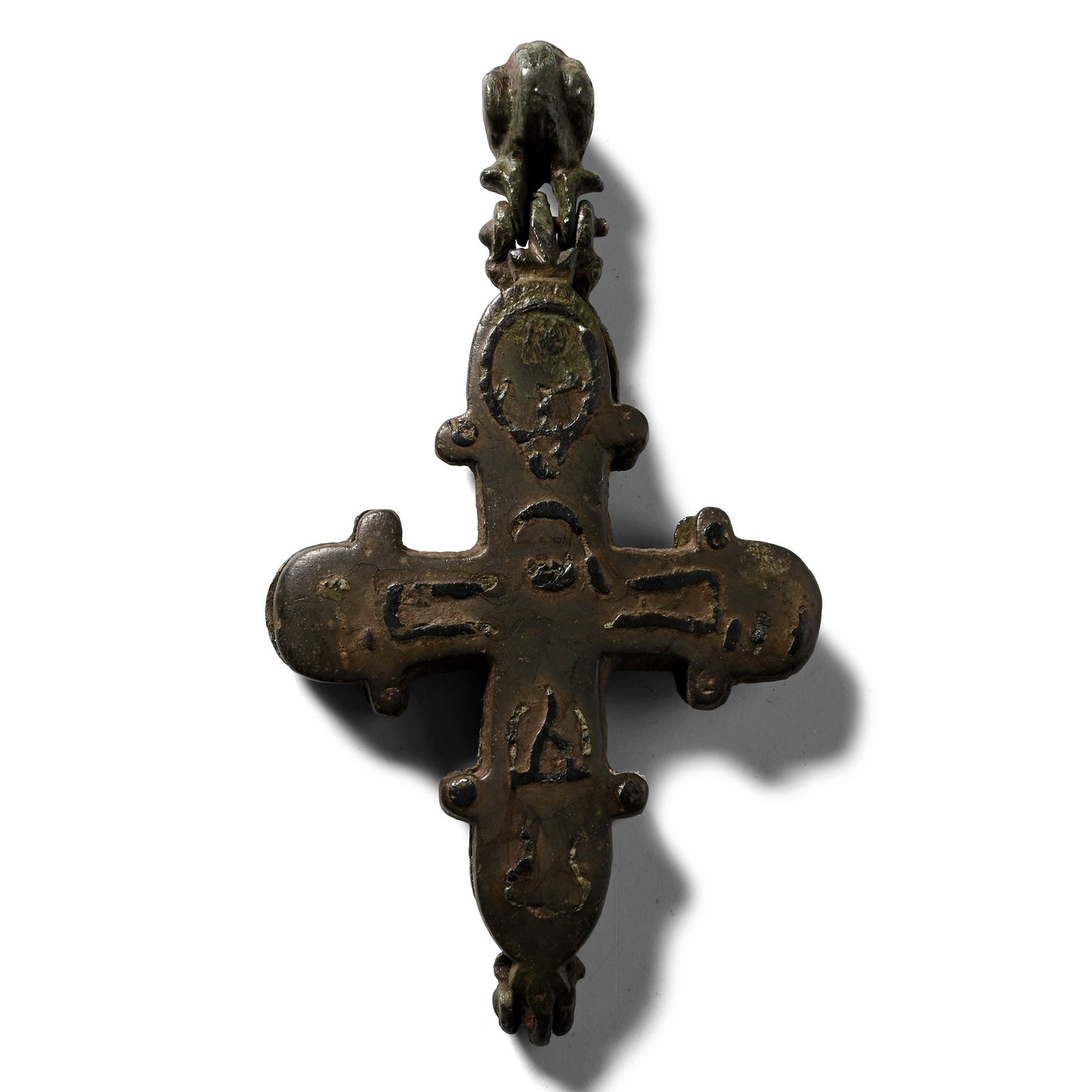 Large Byzantine Bronze Cross Pendant: Circa 10th-12th century A.D. Enkolpion cross pomm?e hinged at the base and closure with facetted suspension loop above; obverse with silver-inlaid cross and (abraded) monogram to each roundel; reverse