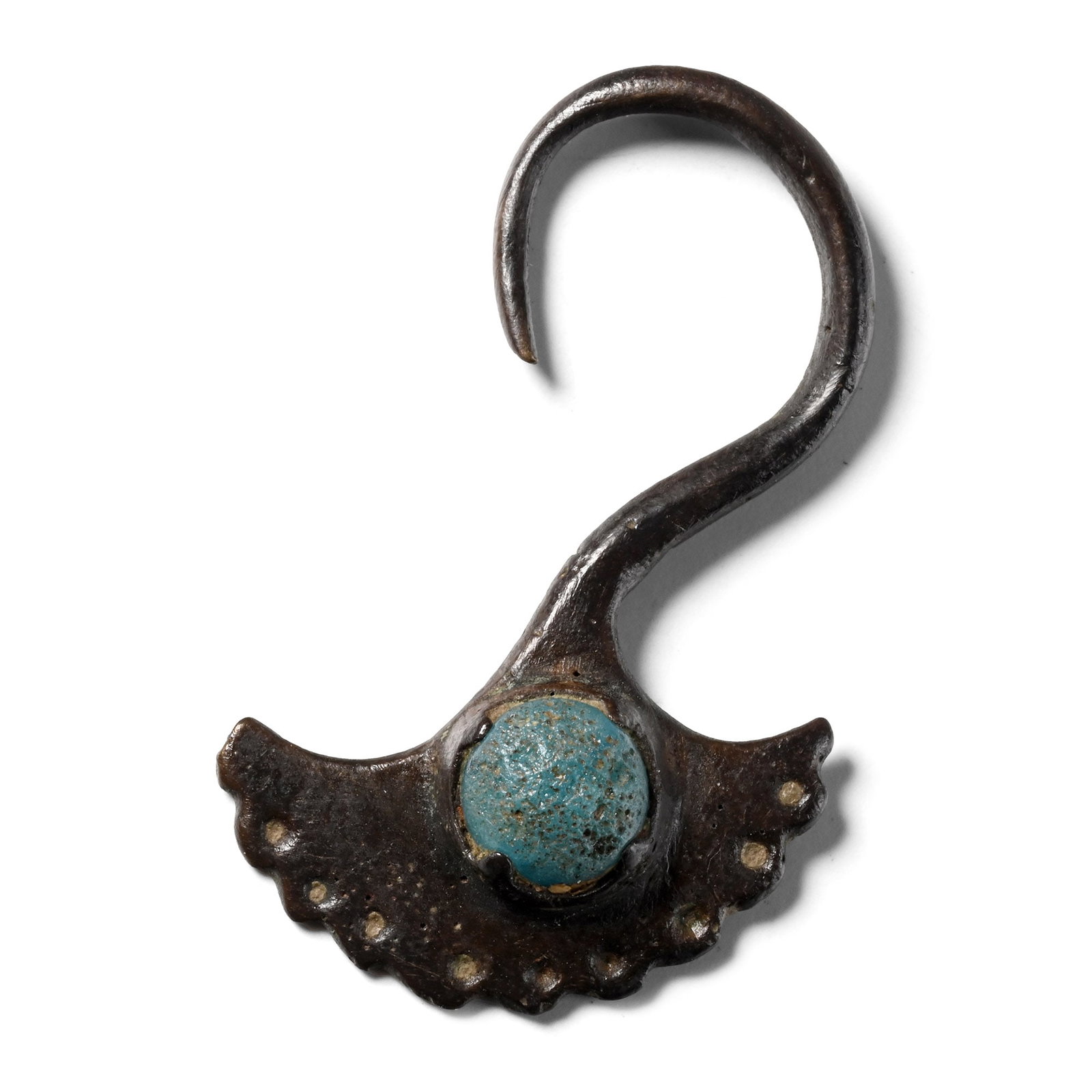 Byzantine Bronze Earring with Glass Gem: Circa 6th-8th century A.D. Fan-shaped earring with recurved suspension hook; notched outer edge with punched pellets, cell with inset blue glass cabochon. 5.14 grams, 40 mm (1 5/8 in.). [No Reserve] F