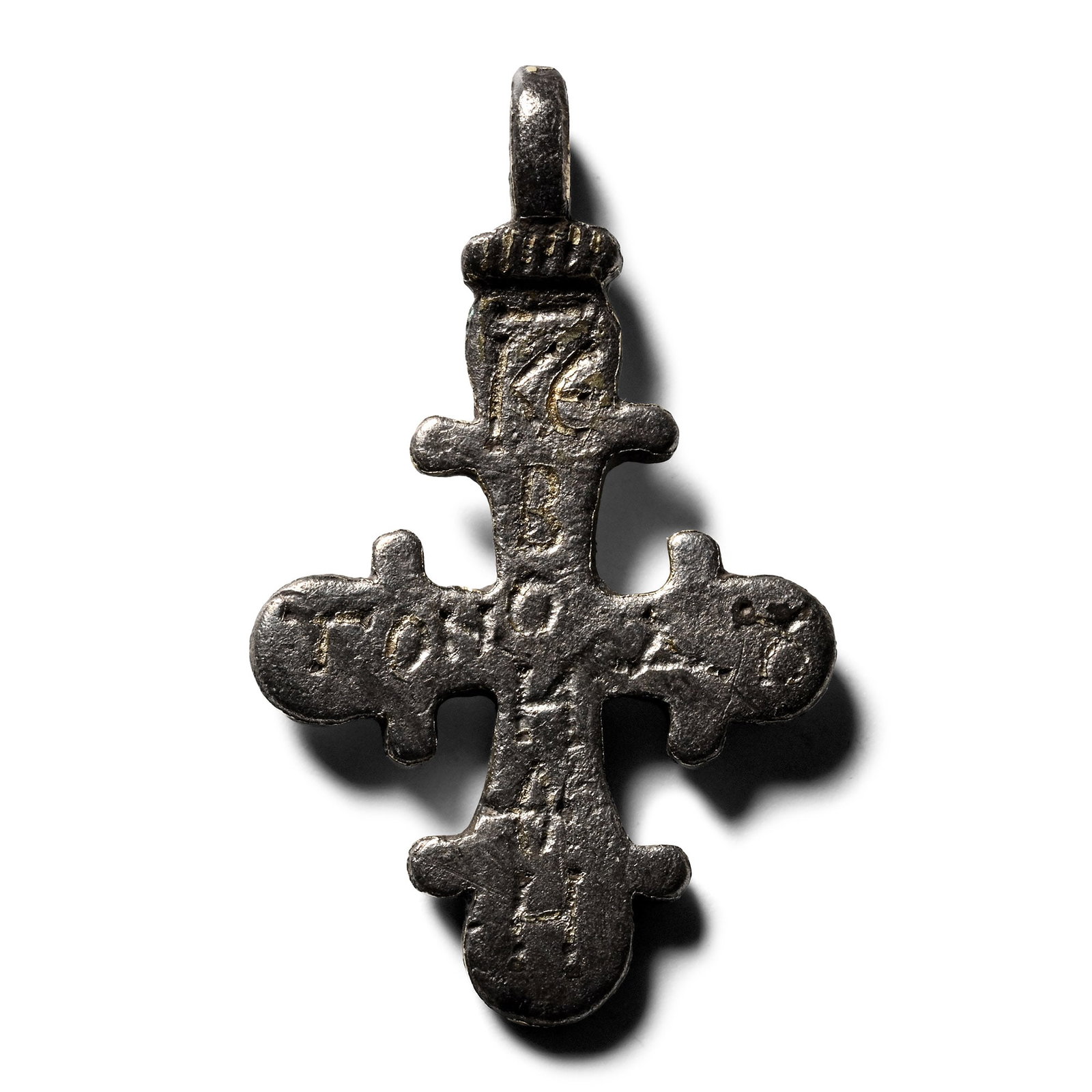 Byzantine Silver-Gilt Cross Pendant: Circa 9th-12th century A.D. Bifacial cross with lobed finials, gilt Greek inscription on both sides, one side with 'KE BOH??' placed vertically and 'TON ?OY[..]' horizontally; the other side with '?ON