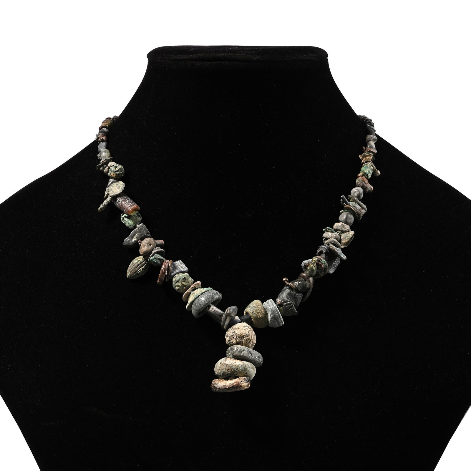 Western Asiatic Stone and Other Bead Necklace String: 1st millennium B.C. and later. Graduated group composed of mixed beads and pendants, restrung. 59 grams, 38.5 cm (15 1/8 in.). [No Reserve] Ex Ancient Art Shop, Windsor, UK, 1990s. Ex private West Cou