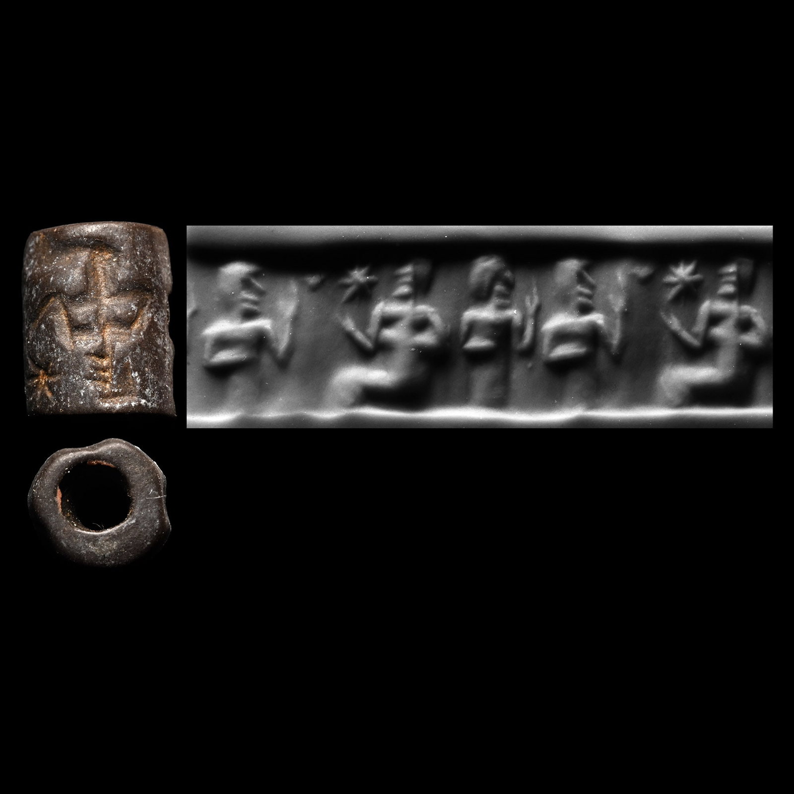 Syrian Haematite Cylinder Seal with Deity: Circa 2500-1800 B.C. A small seal with a deity on a throne, two worshippers before and a star as a filler motif; supplied with a museum-quality impression. Cf. similar seals n Wilson, J.A., Allen, T.G
