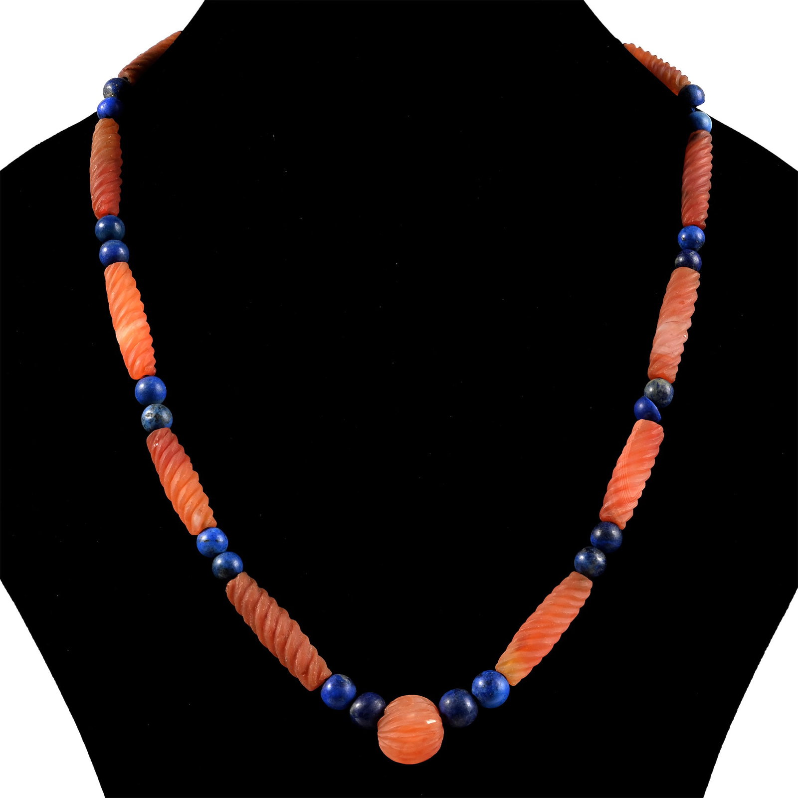 Bactrian Style Lapis Lazuli and Carnelian Bead Necklace String: 20th century A.D. Designer necklace composed of spherical beads interspersed with barley twist beads; restrung. 66.5 grams, 52.5 cm (20 3/4 in.). [No Reserve] Acquired in the 1990s-early 2000s. Ex Lon