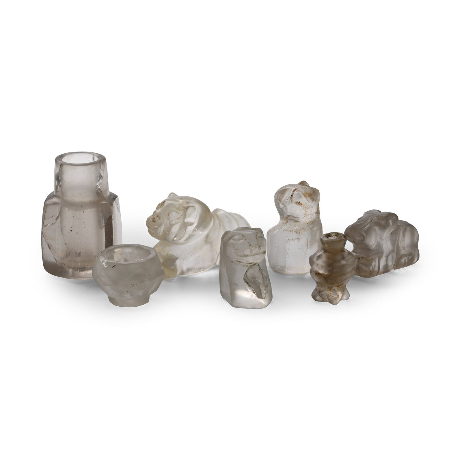 Western Asiatic Rock Crystal Animal and Other Artefact Collection: 20th century A.D. Including a cat's head, a crouching lion, a dog and other designs. Cf. for similar ancient works in rock crystal Whitehouse, D., Islamic glass in the Corning Museum of Glass,New York