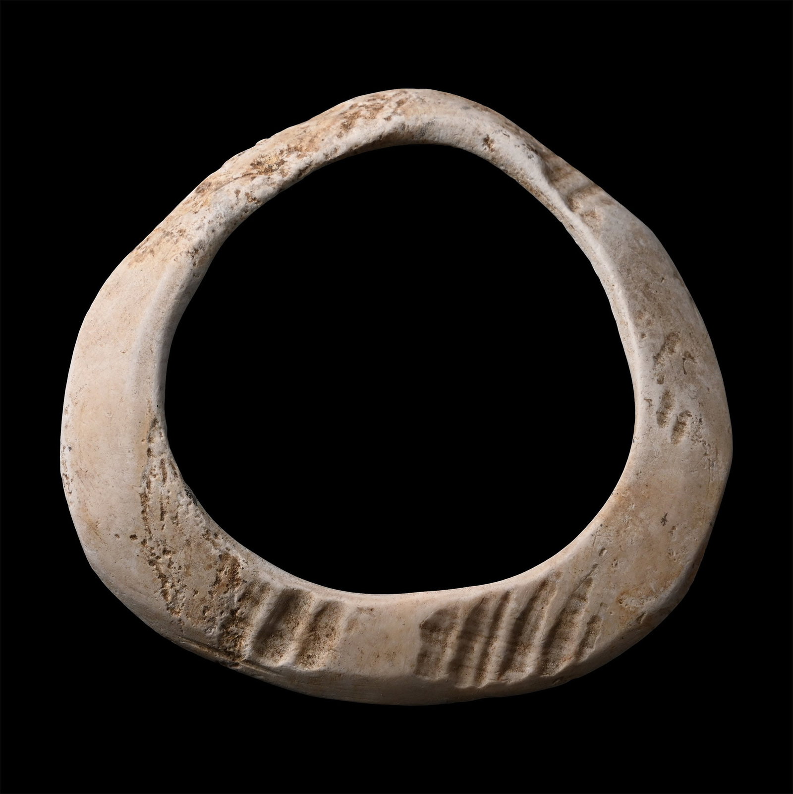 Sumerian Shell Bangle: 4th-3rd millennium B.C. Creamy-white annular panel, domed in section, cut from a shell plate. For similar see Higham, C., Early Cultures of Mainland Southeast Asia, burial 26. 36.7 grams, 89 mm (3 1/2