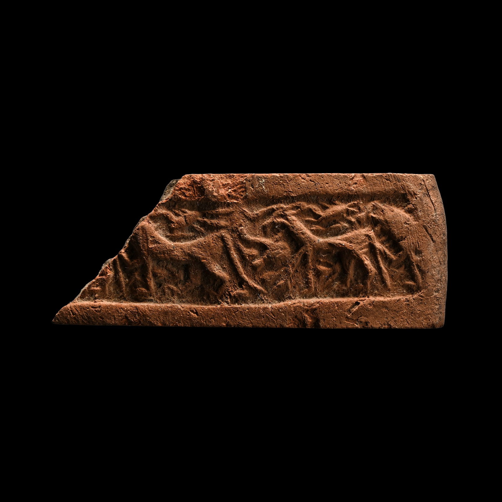 Western Asiatic Terracotta Cylinder Seal Impression with Animals: 1st millennium B.C. Thick section with a band of impressed advancing animals. Cf. a similar seal in Wilson, J.A., Allen, T.G., Ancient Oriental Cylinder and Other Seals, with a description of the coll