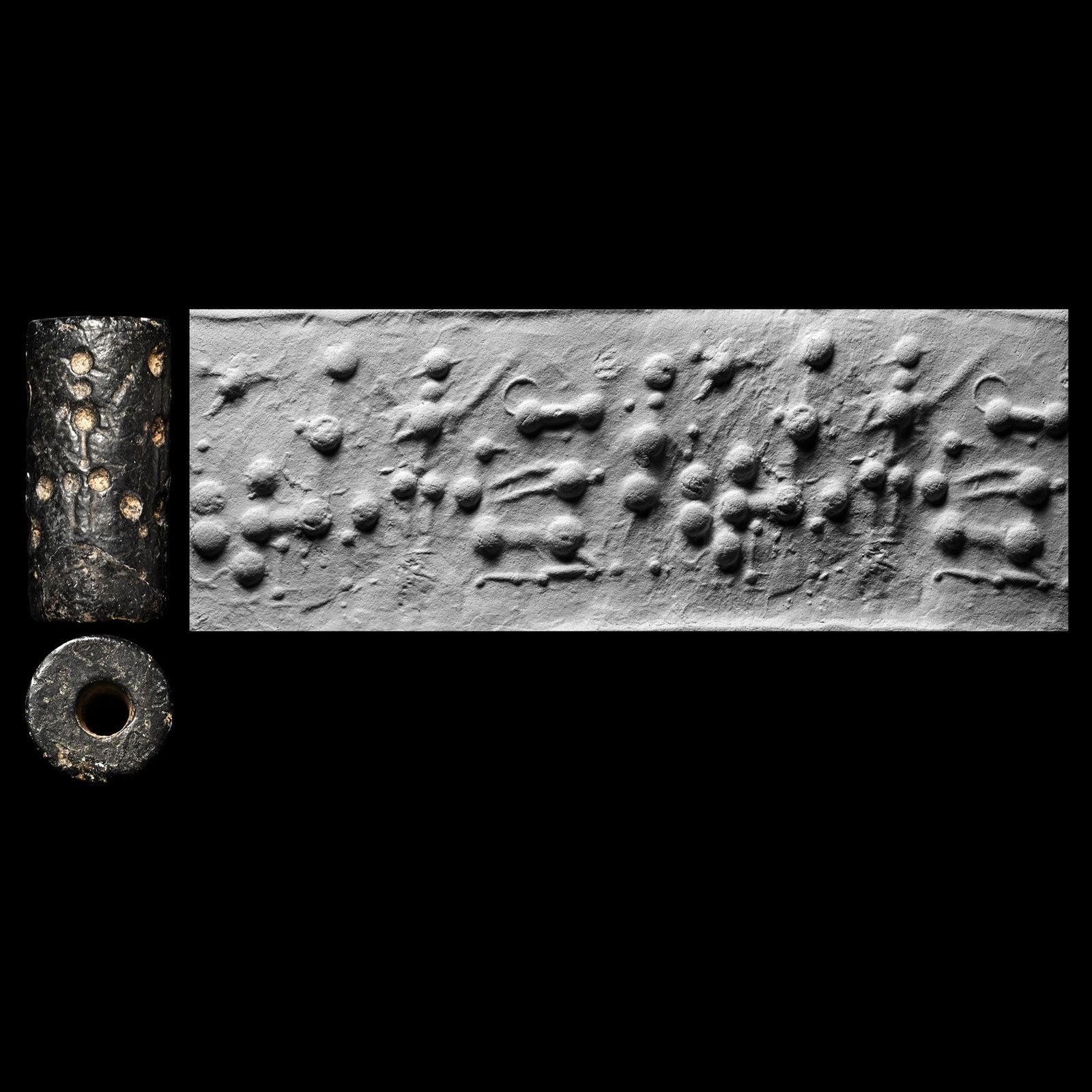 Neo-Assyrian Haematite Cylinder Seal: Circa 800-700 B.C. Opaque seal with a lion cub, a woman with raised arms, seven stars depicting the Pleiades, and a reclining gazelle; supplied with a museum-quality impression. Cf. cylinders in simil