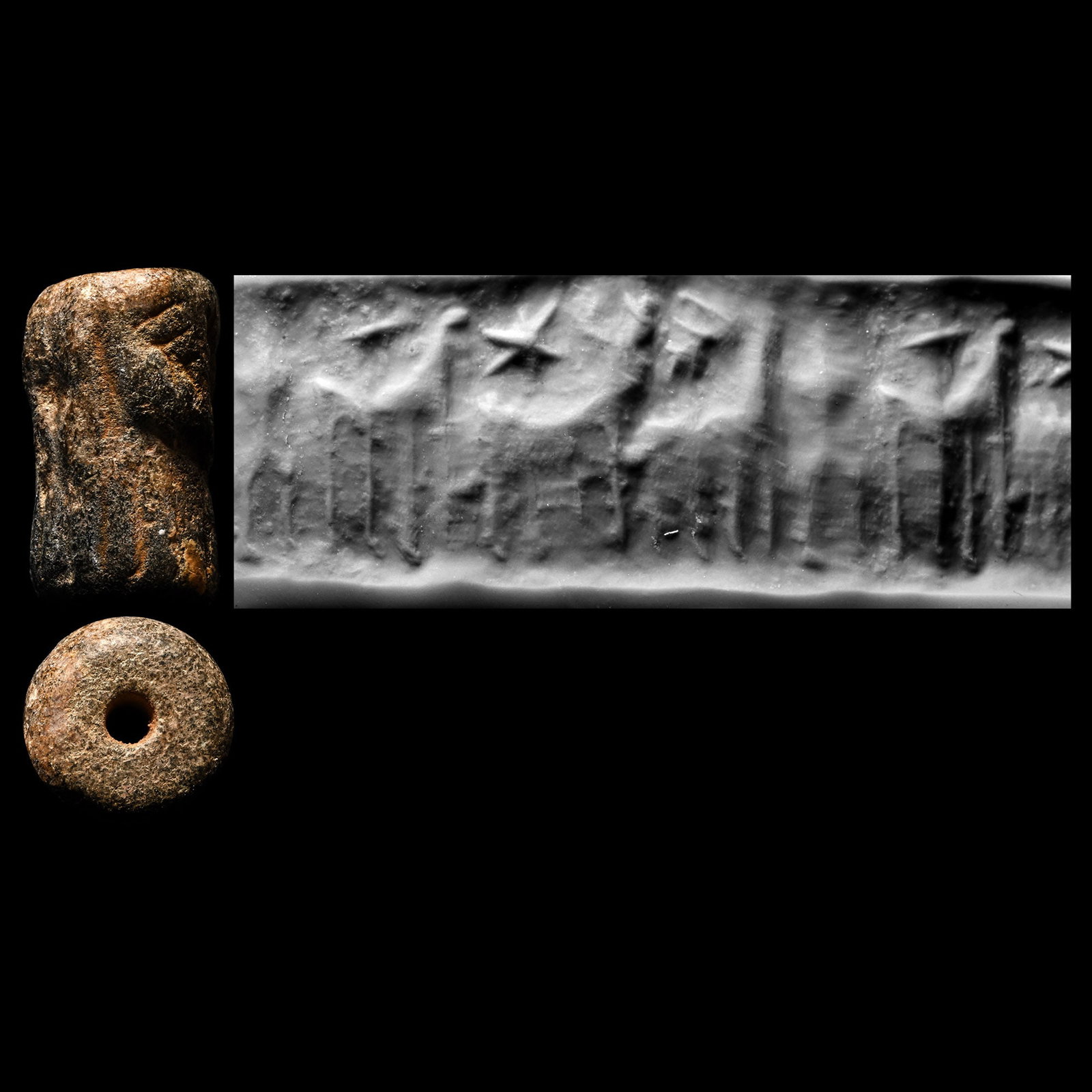 Syrian Steatite Cylinder Seal with Beasts: Circa 1300 B.C. A reused seal with an untrimmed top, showing a beast with a small beast on its back, a man in front, star as a filler motif; supplied with a museum-quality impression. Cf. a similar se