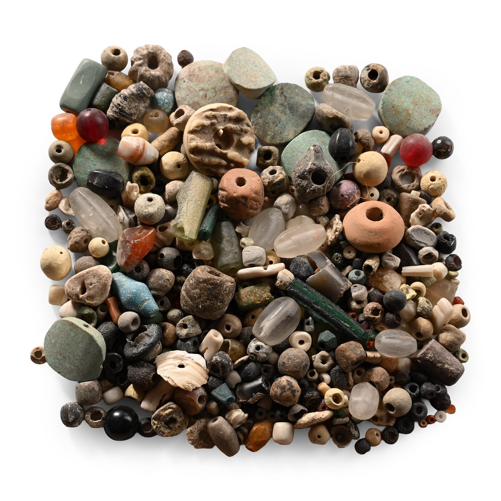 Western Asiatic and Other Bead Group: 1st millennium B.C. and later. Mixed group of various beads, mainly in glass and stone. 159 grams total, 1-25 mm (1/8 - 1 in.). [No Reserve] Acquired in the 1990s. Ex London, UK, collection. TimeLine 