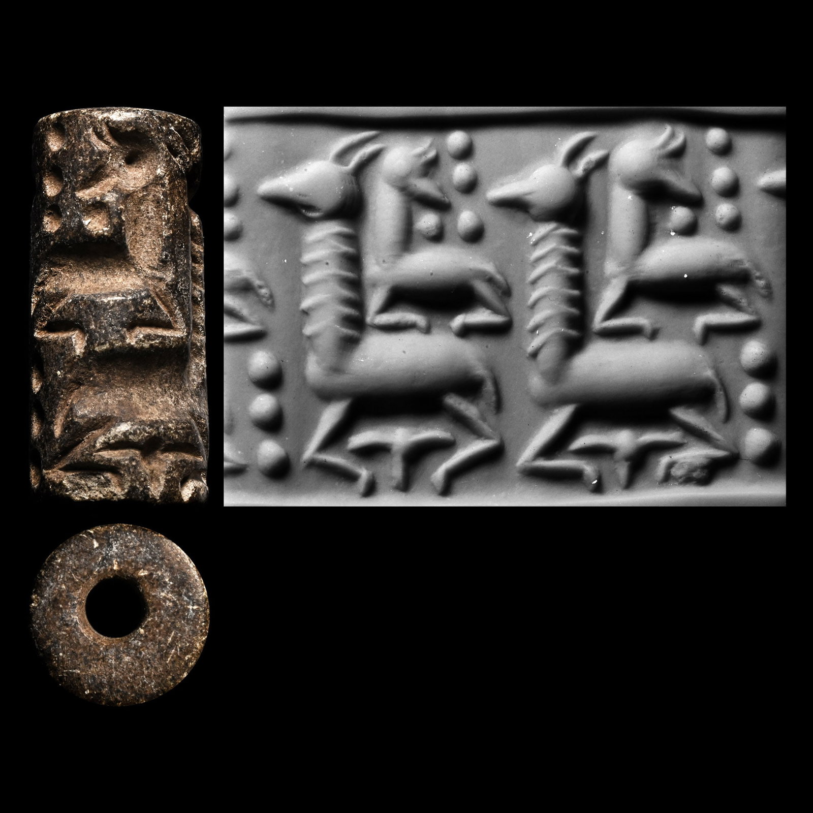 Western Asiatic Steatite Cylinder Seal with Quadrupeds: 2nd millennium B.C. Deeply engraved and showing two reclining quadrupeds with long necks, with two small reclining stags above, pellets on the field; supplied with a museum-quality impression. Cf. a s