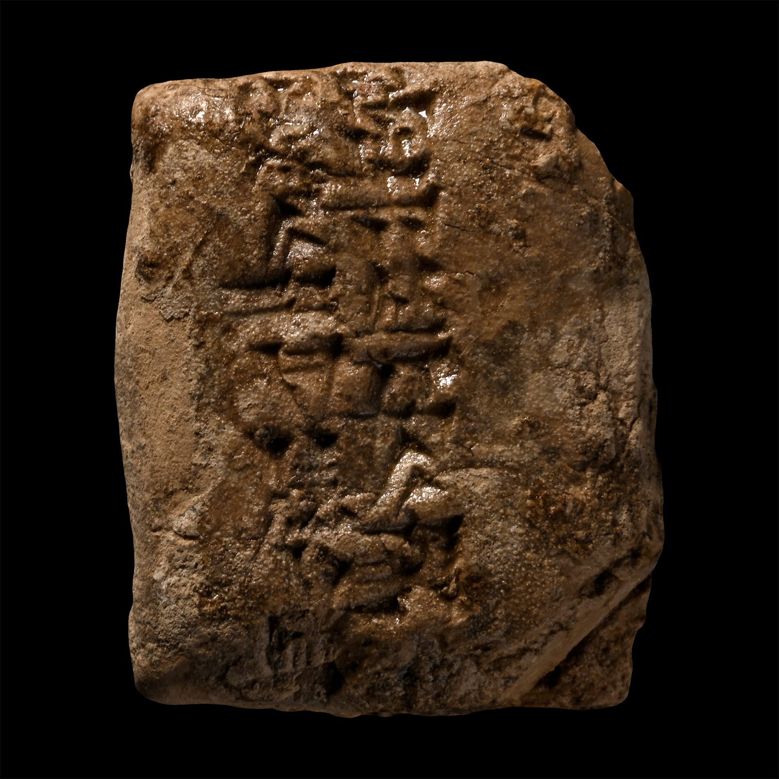 Mesopotamian Terracotta Cuneiform Tablet Fragment: Early 2nd millennium B.C. Rectangular fragment of a tablet with impressed text. 25.8 grams, 37 mm (1 1/2 in.). [No Reserve] Specialised collection of cuneiform texts, the property of a London gentlema