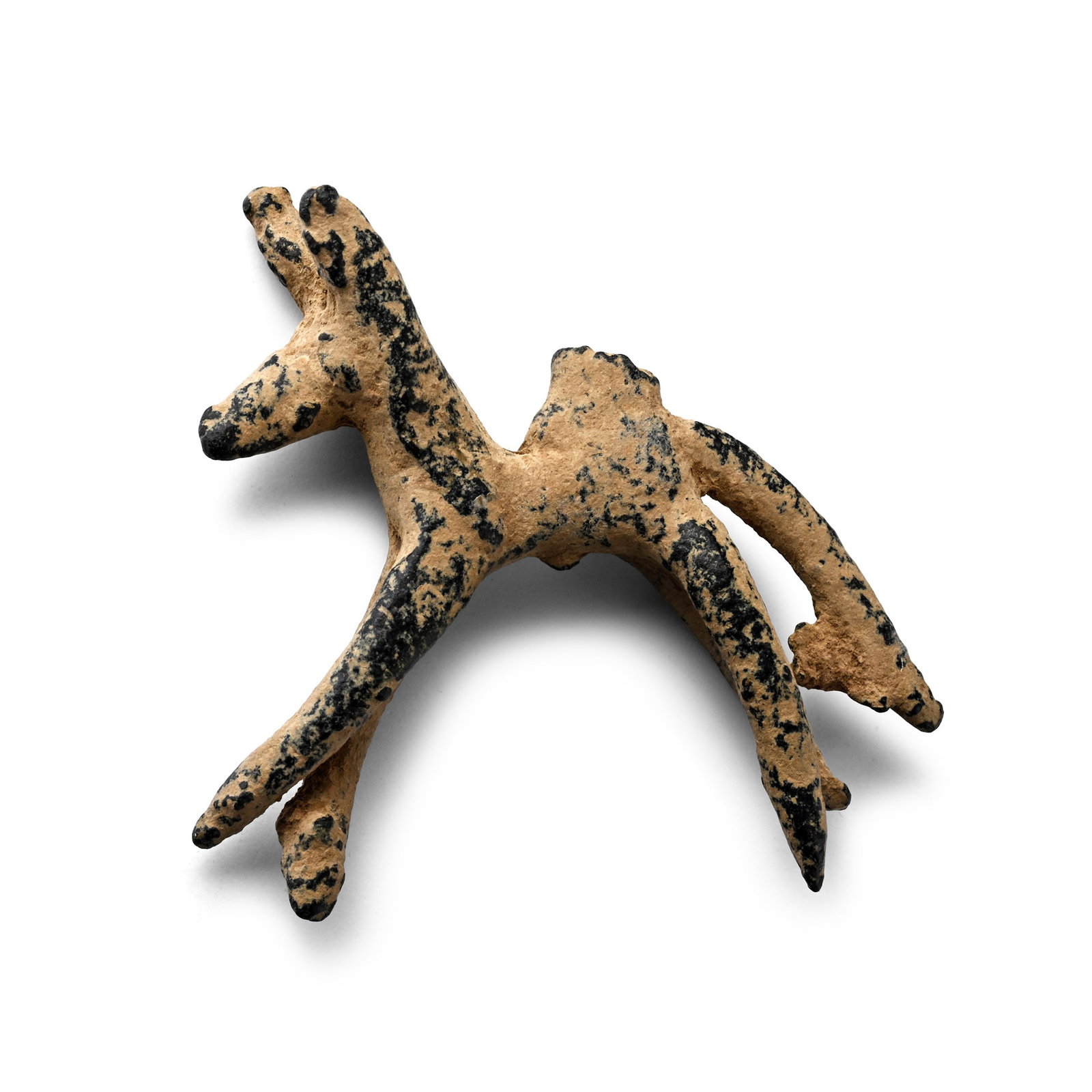 Luristan Bronze Model of a Horse: 1st millennium B.C. Featuring a thin body and elongated legs, a long tail pointing downwards and a short neck supporting an emphasised with pointed ears. 12.16 grams, 40 mm (1 5/8 in.). [No Reserve] E