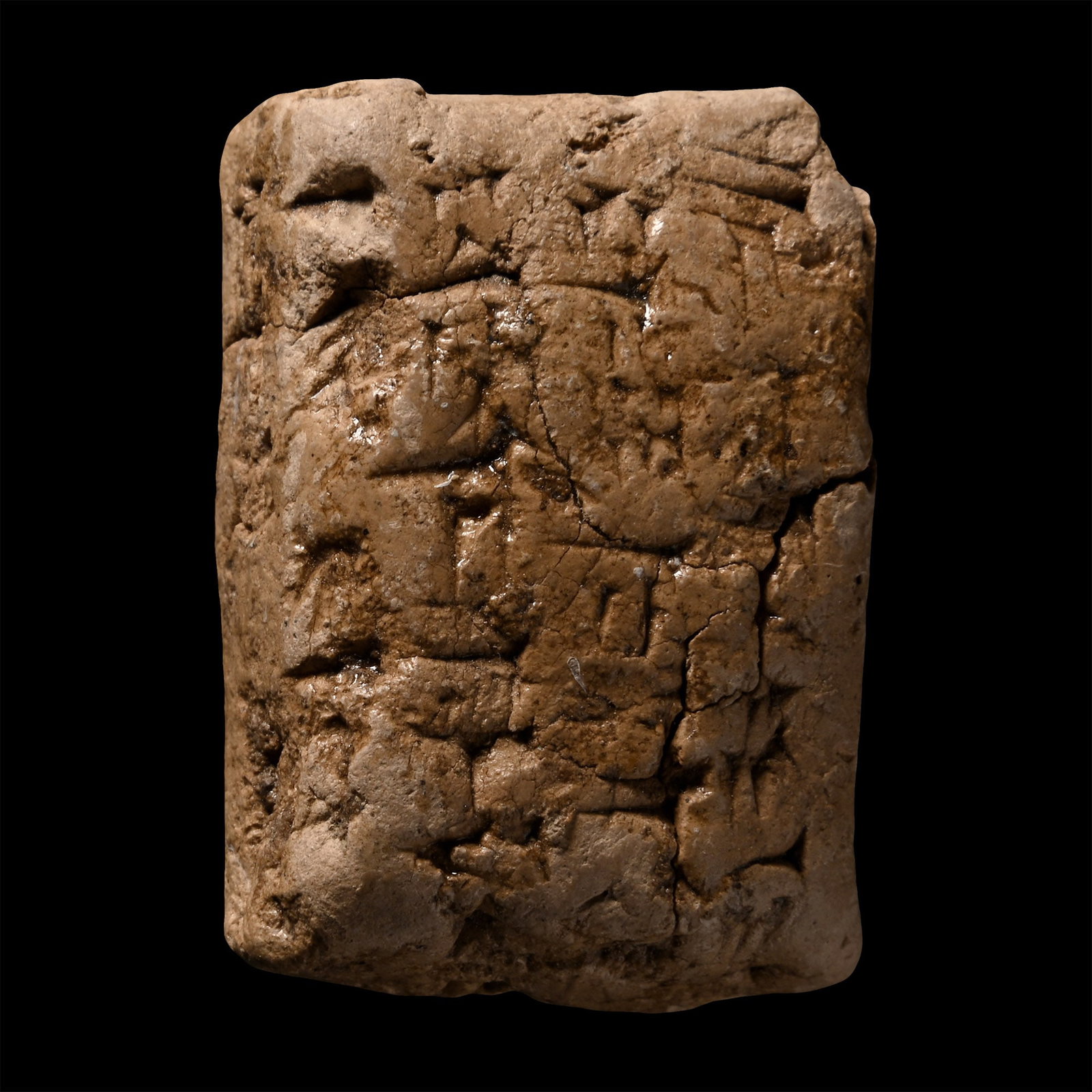 Mesopotamian Terracotta Cuneiform Tablet: Early 2nd millennium B.C. Small rectangular tablet with impressed text on four sides. 24.1 grams, 37 mm (1 1/2 in.). [No Reserve] Specialised collection of cuneiform texts, the property of a London ge