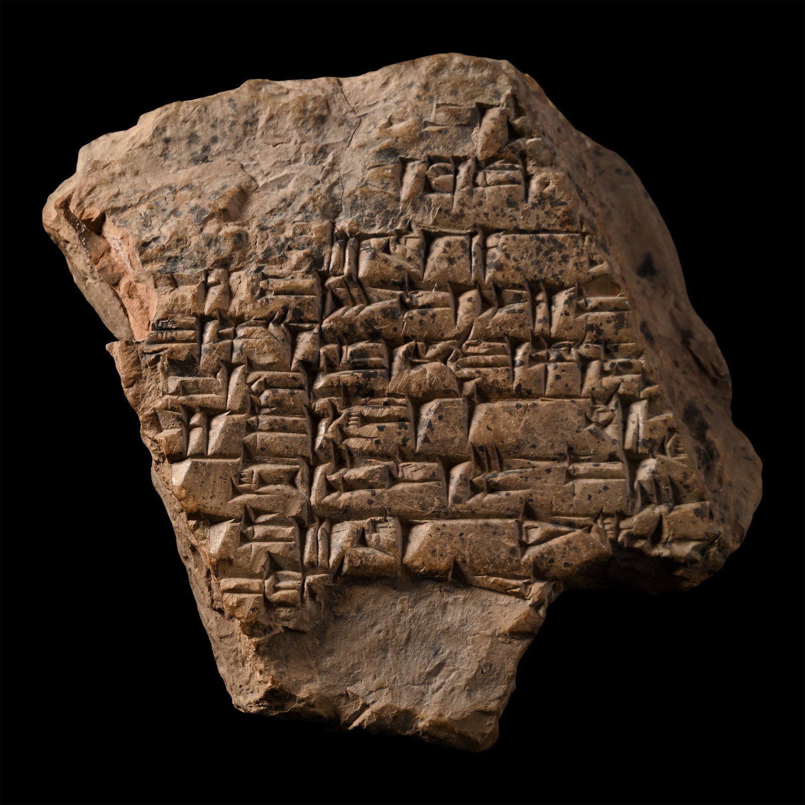 Ur III Terracotta Cuneiform Tablet Fragment: Circa 21st century B.C. Polygonal fragment with densely arranged impressed cuneiform text on one side. 67 grams, 74 mm (2 7/8 in.). London, UK, art market, 1980s. Private collection, London, UK. TimeL