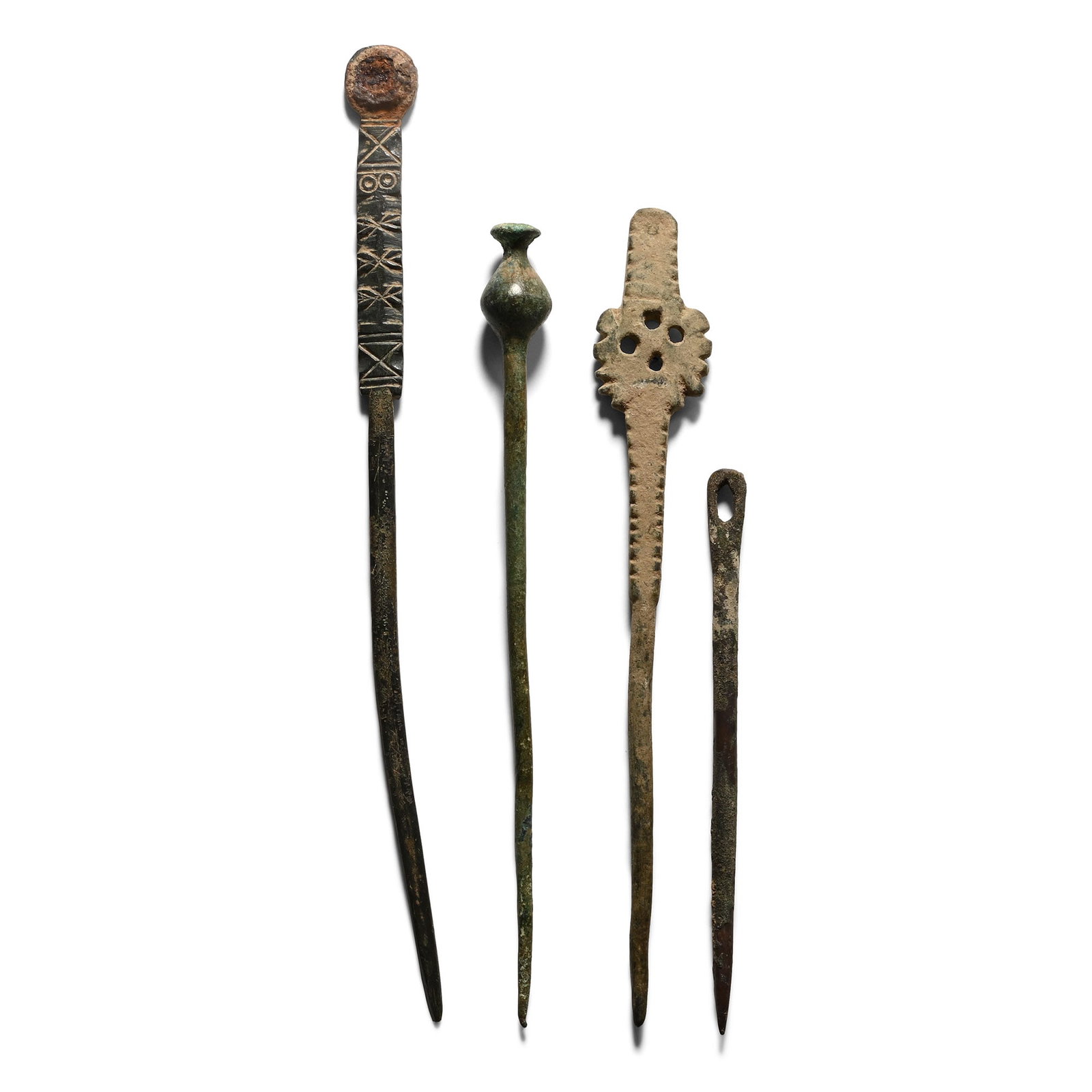 Western Asiatic Bronze Pin Collection: 1st millennium B.C. Including thistle-head finial, openwork cross finial and other types. 64.5 grams total, 9.4-16.4 cm (3 3/4 - 6 1/2 in.). [4, No Reserve] From the private collection of Mr Brian Edw