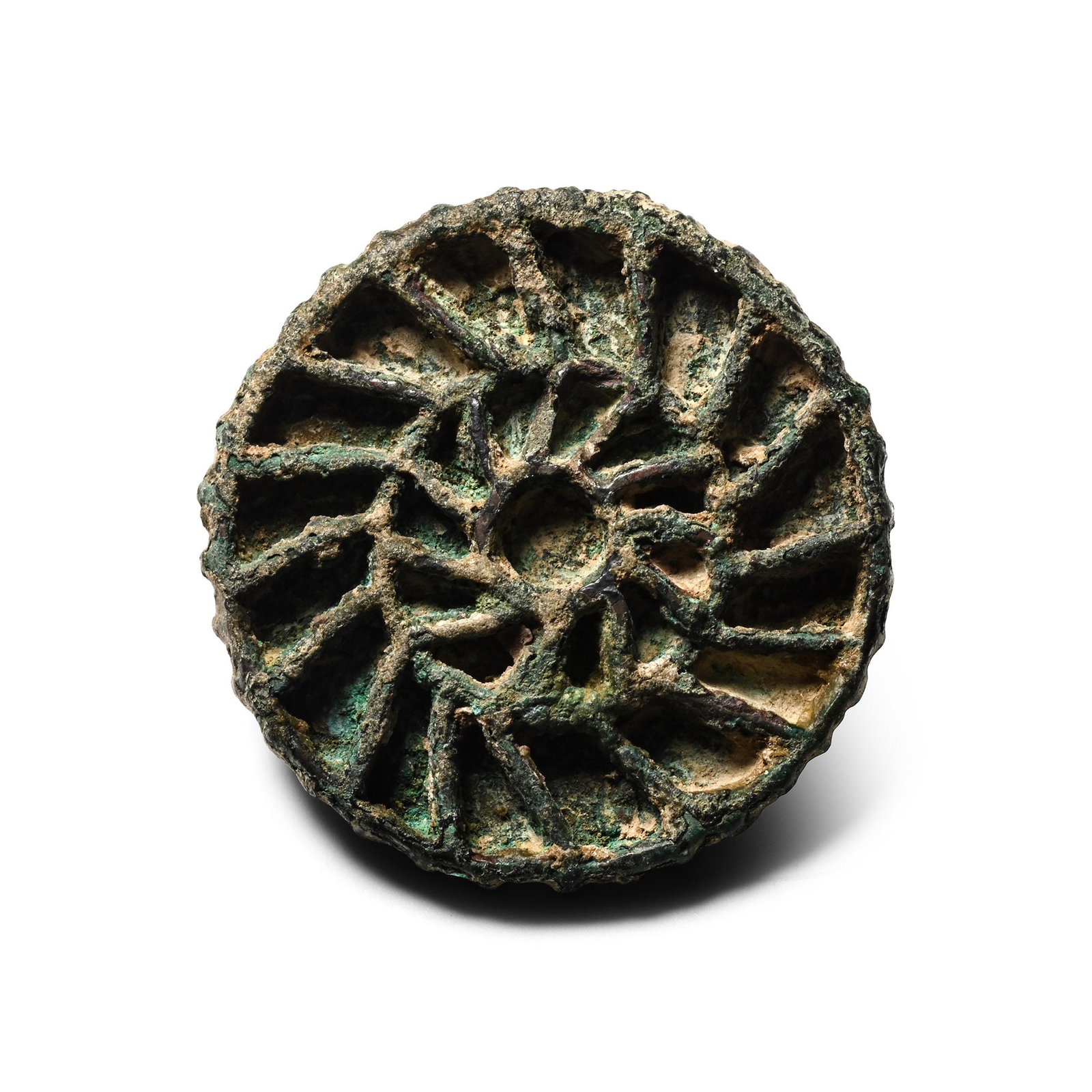 Large West Central Asian Bronze Double Sun-Whorl Seal Matrix: Circa 2300-2000 B.C. Discoid stamp seal with segmented face and a flat back with a loop handle, the design consisting of a central circle from which two layers of bands spread towards the edge. 38.7 g